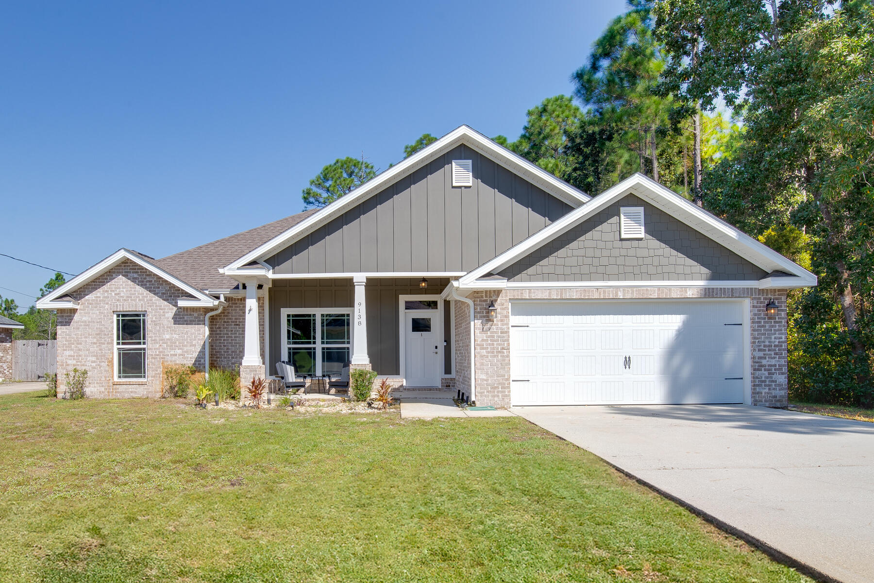 Welcome in to a beautiful 2018 build situated on over half an acre with custom finishes! As you walk in you'll be captivated by the large living room with trey ceiling and recessed lighting. The spacious kitchen boasts quartz counter tops, tiled backsplash, breakfast bar, grey cabinets with soft close glides, double pantries and stylish floating shelves. The split floor plan offers a master bedroom oasis on one end of the home featuring a large bathroom with double vanity, tile shower with glass enclosure and rain shower head, and garden tub. The laundry room is conveniently placed next to the huge master closet! Enjoy coffee on either your front or back covered porch! Huge yard for the kids and/or dogs to run and play!
Irrigation makes lawn maintenance a breeze. Fabric hurricane shields included and cut down on insurance costs.This home has it all!
