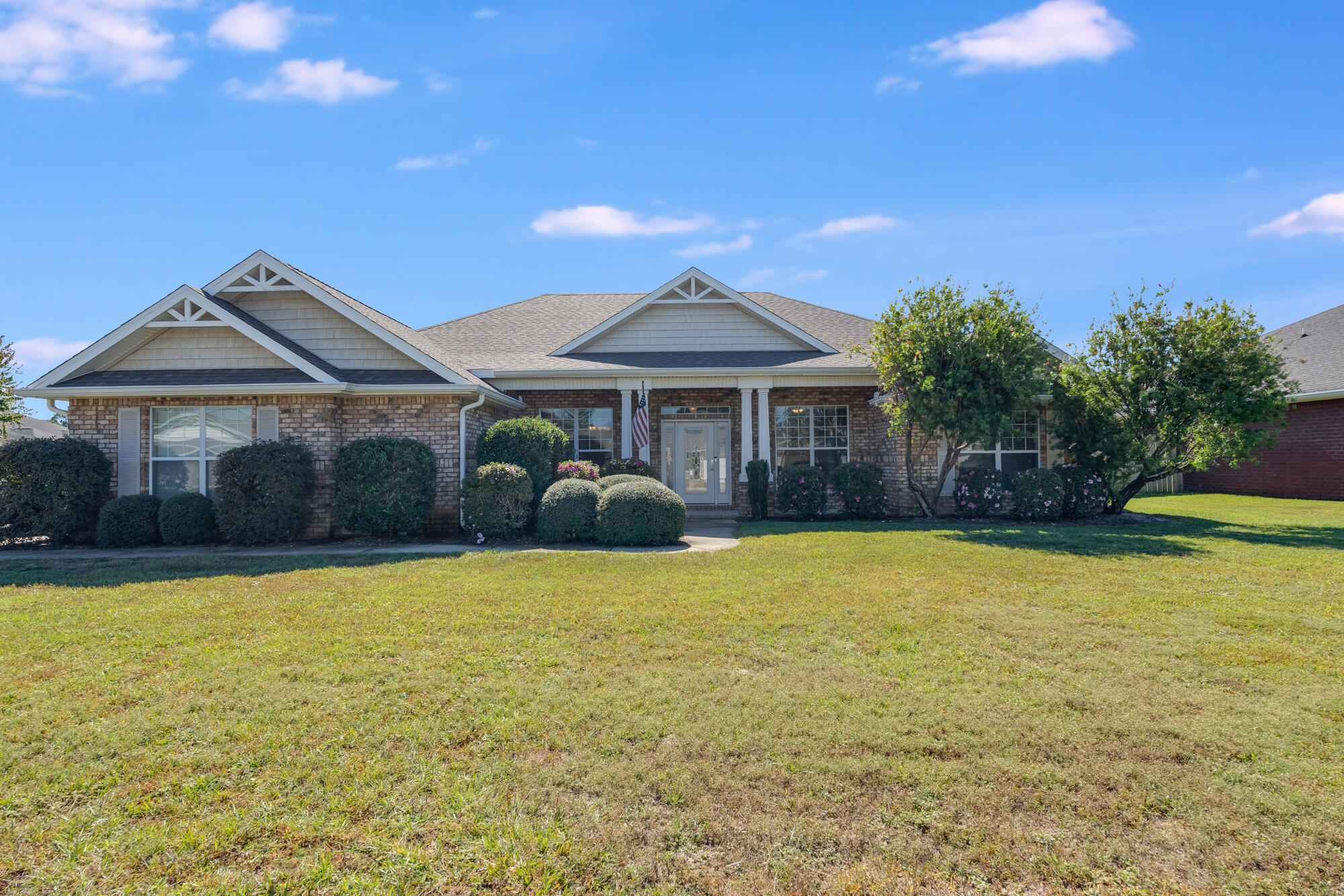 VA Assumable. This beautiful home in East Navarre is just minutes from Hurlburt Field, shopping, schools and the stunning, sugary white sand of Navarre Beach! The spacious floor plan offers 4 sizable bedrooms, 3 full bathrooms and an office with French doors. The kitchen features granite countertops, a new fridge (2023), and a new dishwasher (2024).The backyard is accessed through a screened-in lanai, where you'll find a stunning newer (2021) sparkling gunite pool, equipped with in-pool lighting (remote controlled), and a professionally installed pool fence (easily removable).Additional features include a 3 car garage, a new roof (Aug. 2023), new HVAC system (2021), easy-access generator hookup, and a fully transferable termite bond, at no cost to the new buyer.