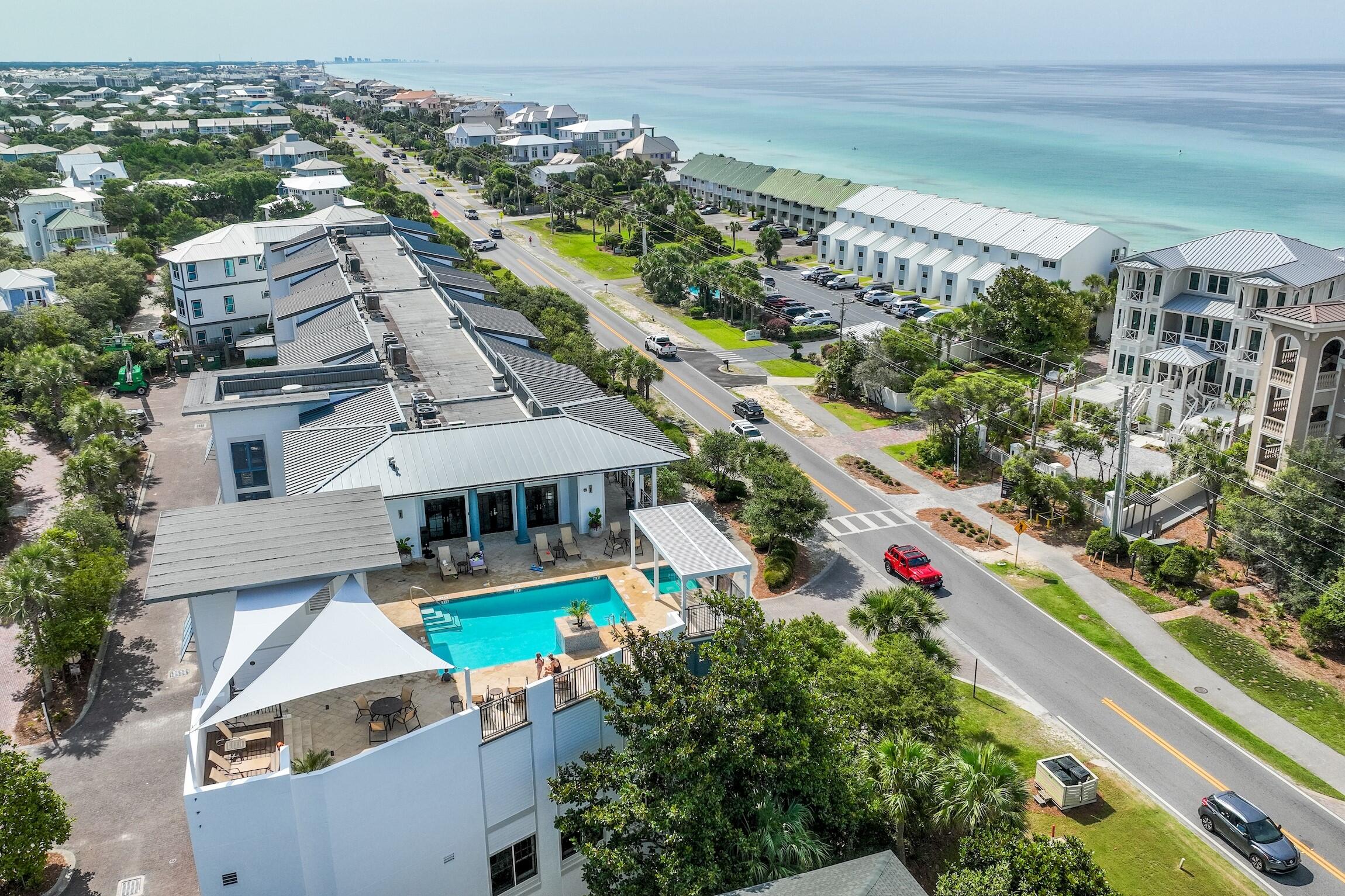 Resort style living in the highly sought after Waterhouse Condominiums, a luxurious property with deeded beach access and beach chair service (included in HOA dues) directly across the street from your private lanai. This ground floor unit allows you to conveniently park your vehicle in front of your door. The unit has a spacious, open floor plan on one level with 10' ceilings, new white oak hardwood flooring throughout, wall of floor to ceiling sliding glass doors leading to private lanai, also accessible from the master bedroom. The limestone-tiled master bath features a jetted soaking tub, separate shower, and double vanity. A spacious full-size laundry room and a private exterior storage closet, perfect for storing beach gear. Beautifully furnished, stainless-steel appliances and gran