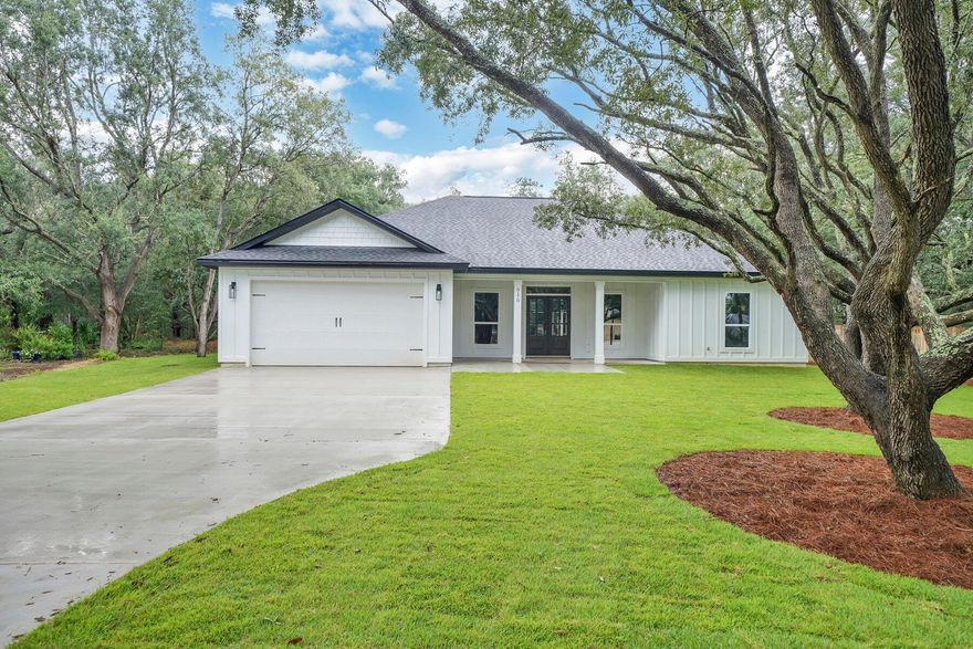 BEAUTIFUL, mature trees. High, dry, no wetlands, X flood zone; fenced, no HOA, well established subdivision of well maintained homes; convenient to EVERYTHING including great schools, famous, beautiful Navarre, FL beaches, medical, shopping, groceries, military bases, on sewer, quiet county maintained paved road, great neighbors. Split plan, light colors, contemporary design, huge covered rear patio, large front porch, mahogany front door, LVT light colored wood look flooring throughout; porcelain tile in wet areas; river rock in walk in Master Shower, double sinks in Master Bathroom; dimensional architectural shingles; white cabinets; large pantry; inside laundry; plenty of parking. Includes stove, dishwasher, garbage disposal; microwave