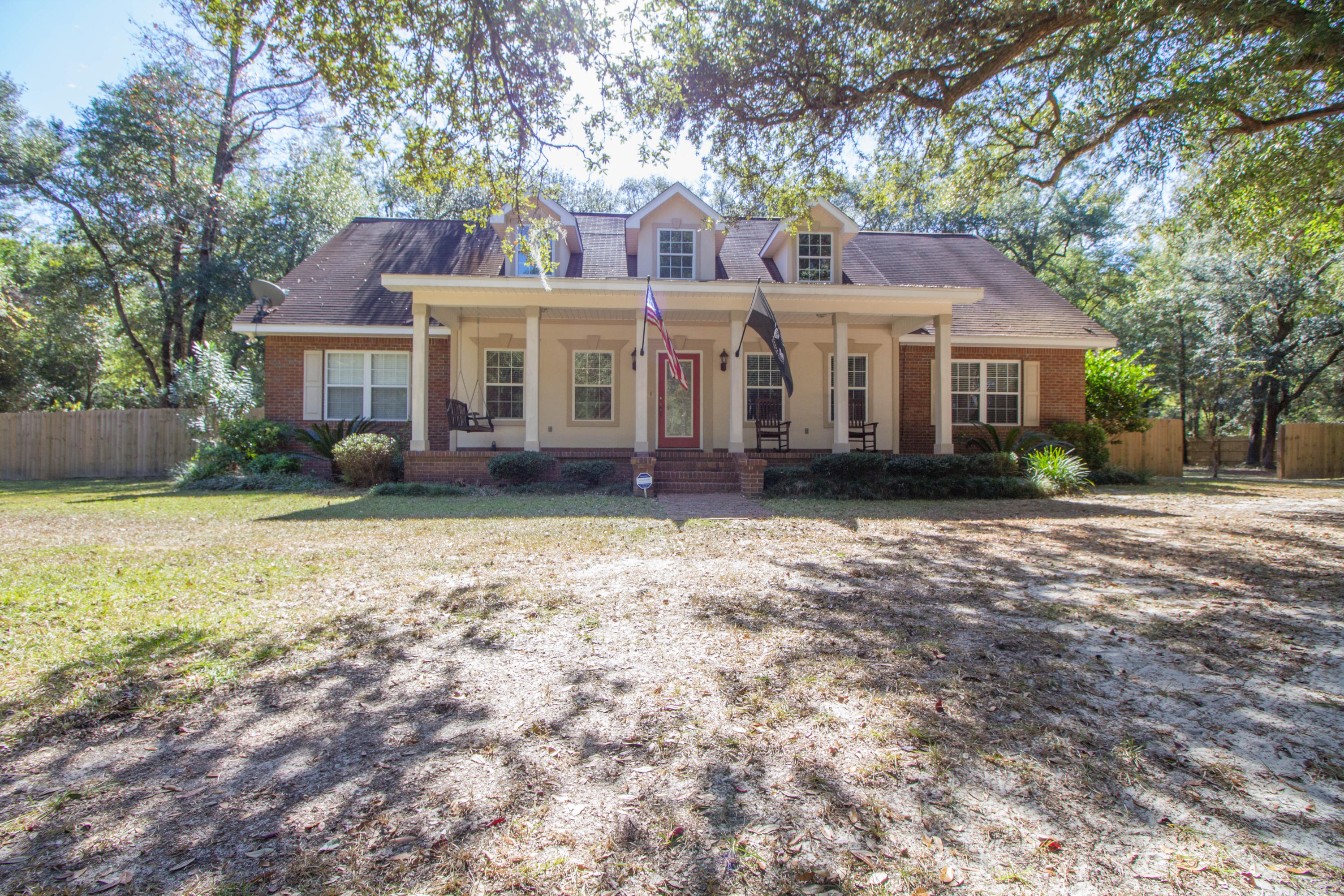 Looking for your country get-away but don't want to sacrifice the commute to work? Well look no further, this beautiful 3 bedroom 3 bath home plus office and bonus room on 2.77 acres is only 30 minutes to your local bases, beaches, and shopping centers. As you enter this home you can picture family and friend gatherings as the floor plan will accommodate anything you throw at it. The large kitchen boasts plenty of cabinets and counter space for all your cooking needs. Looking for that man cave? Climb up the spiral stair case for your very own get away bonus room. In addition to the 3 bedrooms there is a office with a custom built in desk which can easily be converted back to a bedroom if needed. The spacious front and back porches will make you forget all your troubles as you sit down and