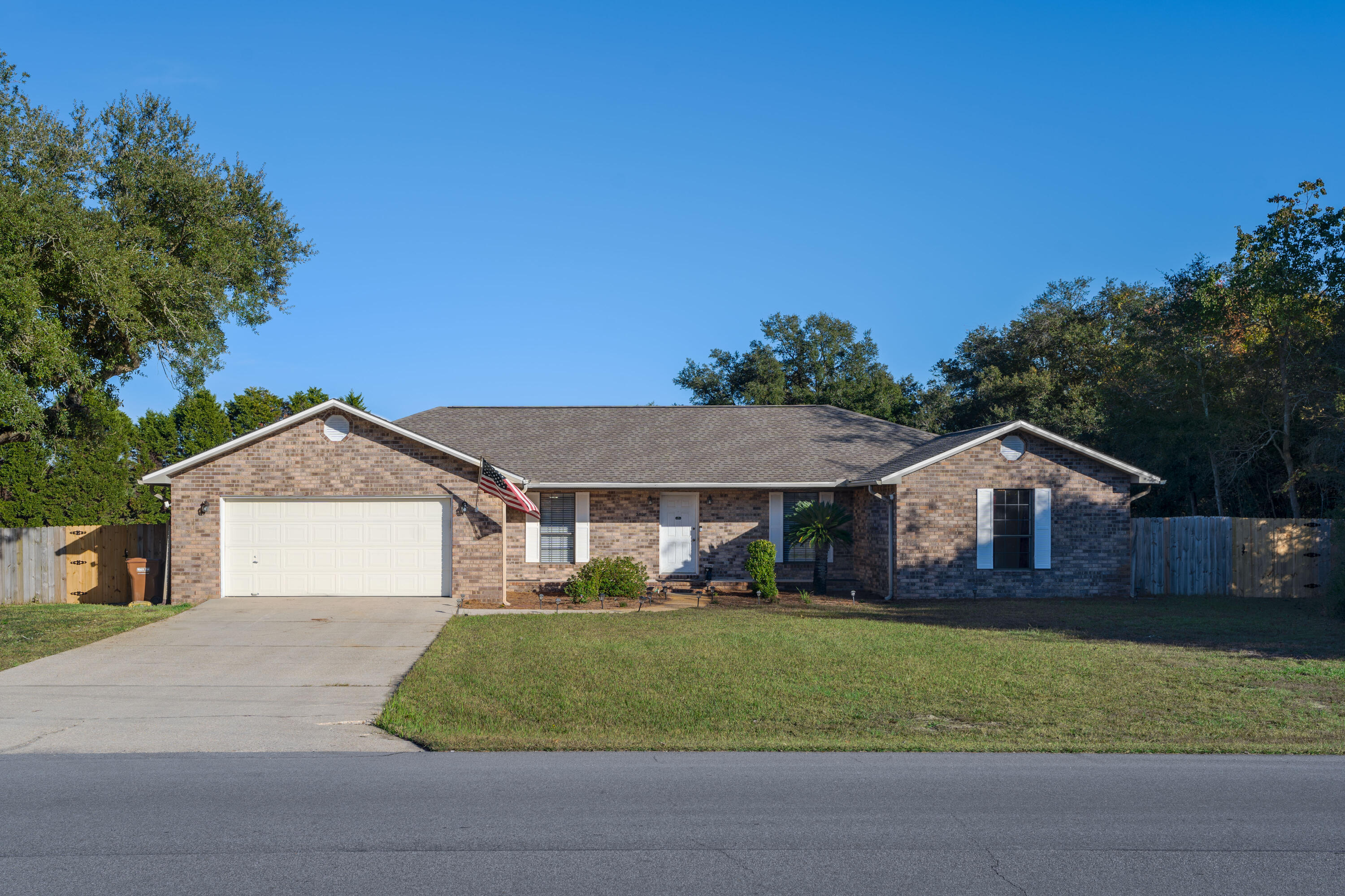 READY FOR A NEW FAMILY!!! Great POOL HOME!  Brick house on a 1-acre lot with an enclosed pool and hot tub added in 2011, a large fenced backyard, and a screened porch complete with epoxy flooring. This house has a 4 bedroom, 2 bath split floorplan with the primary bedroom separated from the other bedrooms, PLUS a flex room which could serve as an office or a formal dining. Bamboo hardwood floors flow through the flex room and the spacious living room. The primary bedroom, kitchen, and breakfast nook look out over the pool. Stainless steel fridge and dishwasher, and a large pantry in the kitchen. The large laundry room between the kitchen and garage has extra room beyond fitting a washer, drier, and extra fridge. Roof 2020, HVAC 2016, Water Heater 2023.