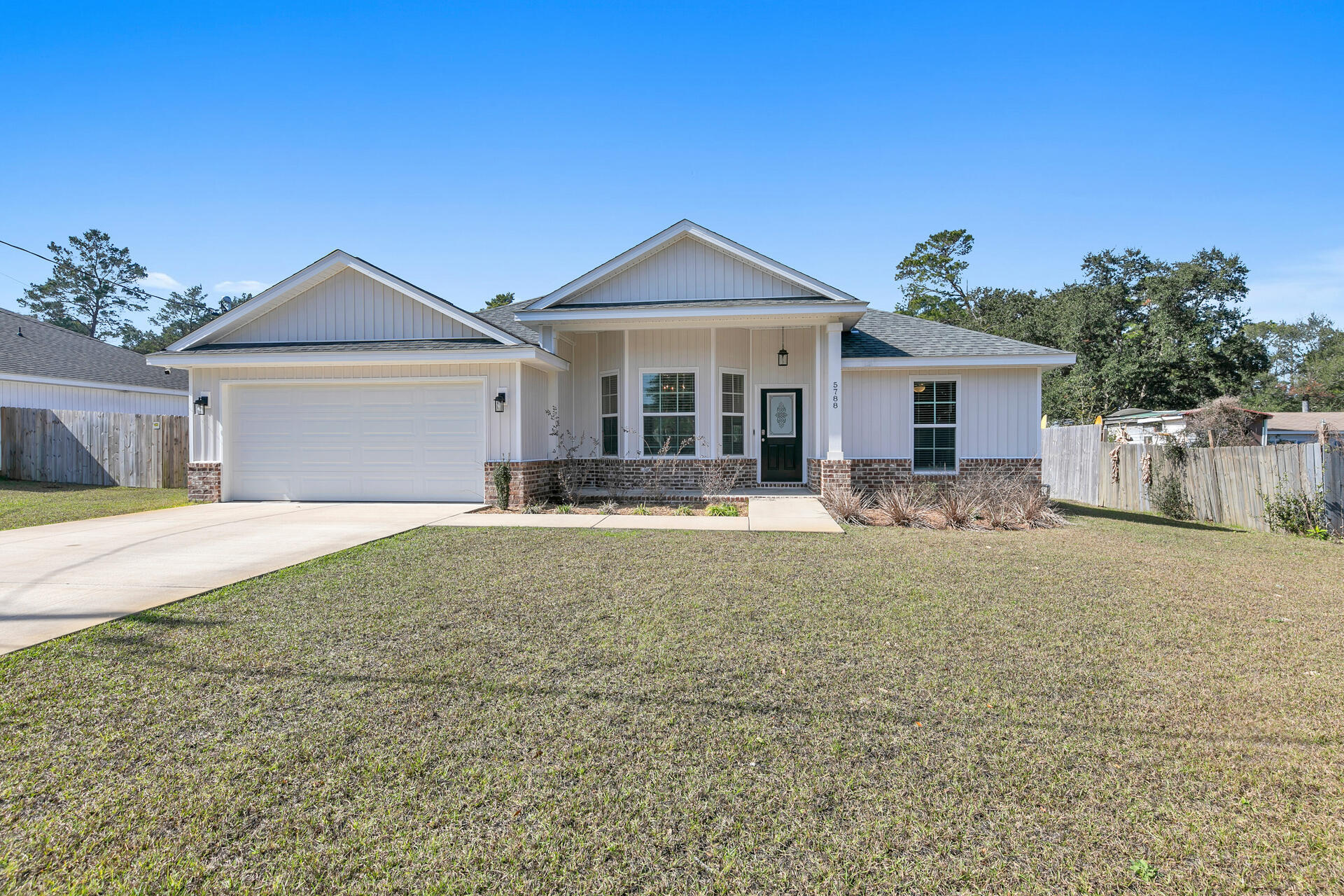 Welcome Home! This 2021 build home has been meticulously cared for and is ready for new owners. Split floorplan with open kitchen and eat in dinette area. LVP flooring in common areas. Spacious indoor laundry and huge walk-in main room closet. Large half-acre lot is partially wooded giving you a secluded view. Plenty of room to entertain on the large covered back porch. Irrigation system on well water. Hurricane fabric shields for all windows and doors. Home has solar panels and a low or no monthly electric bill! Vivint security system stays! Termite bond was just renewed and good through January 2024. 25 minutes from Hurlburt. 20 minutes to Navarre Beach. Come see all that this home has to offer!