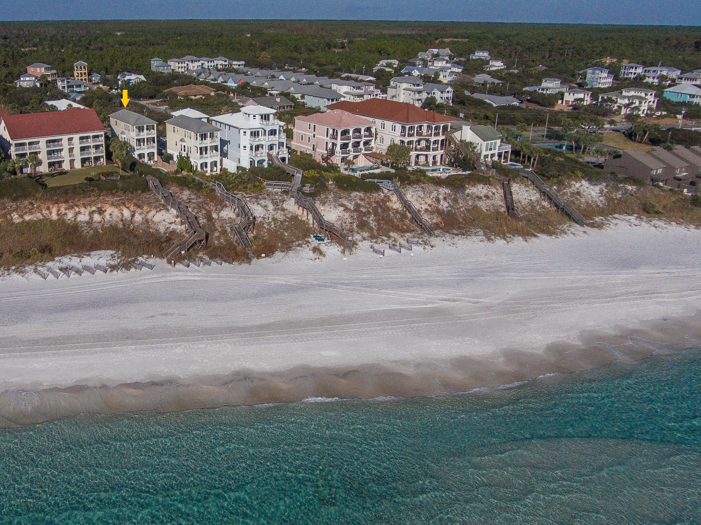Priced to sell! An exceptional value. This five-bedroom Gulf-front beach house with private Gulf-side pool is exceptionally located just a half mile from Alys Beach in the highly sought-after location of 30A's east end. Situated high atop a bluff, the three level beach house enjoys sweeping views from the decks of all three levels, boasting two master suites, each with direct access to gulf-front decks. The interiors have just been fully upgraded to a crisp coastal beach house. Strong established rental income of +$120K per year, projected at +$140K, a smart investment purchase. Adjacent gulf-front home at 8696 Highway 30A is also available for purchase MLS 718587. Combined purchase could provide a beach compound or ideal family ownership or investment opportunity with income of +$300K!