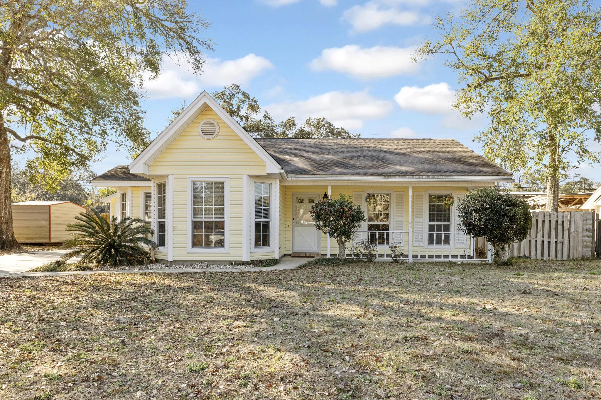 This is a house that feels like home. It has warmth, comfort, & effortless charm. The living room features vaulted ceilings, a stylish exposed beam, and a cozy fireplace creating a space that feels open and inviting. The wood-look tile flooring adds character and durability throughout the main areas.Prime location, you're just minutes from Target, shopping, and daily essentials, with the beautiful beaches close by for weekend escapes. If you're commuting to Hurlburt Field, you're only two miles from the nearest gate.Outside, a spacious backyard and deck invite you to slow down. The large detached garage offers plenty of space for two vehicles plus extra storage, while the long driveway easily accommodates a boat. And with fully paid-off solar panels, you'll love the perks of low electricity bills all year long.
If you've been searching for a home that's as sunny & welcoming as life on the Gulf Coast should be, this is it.