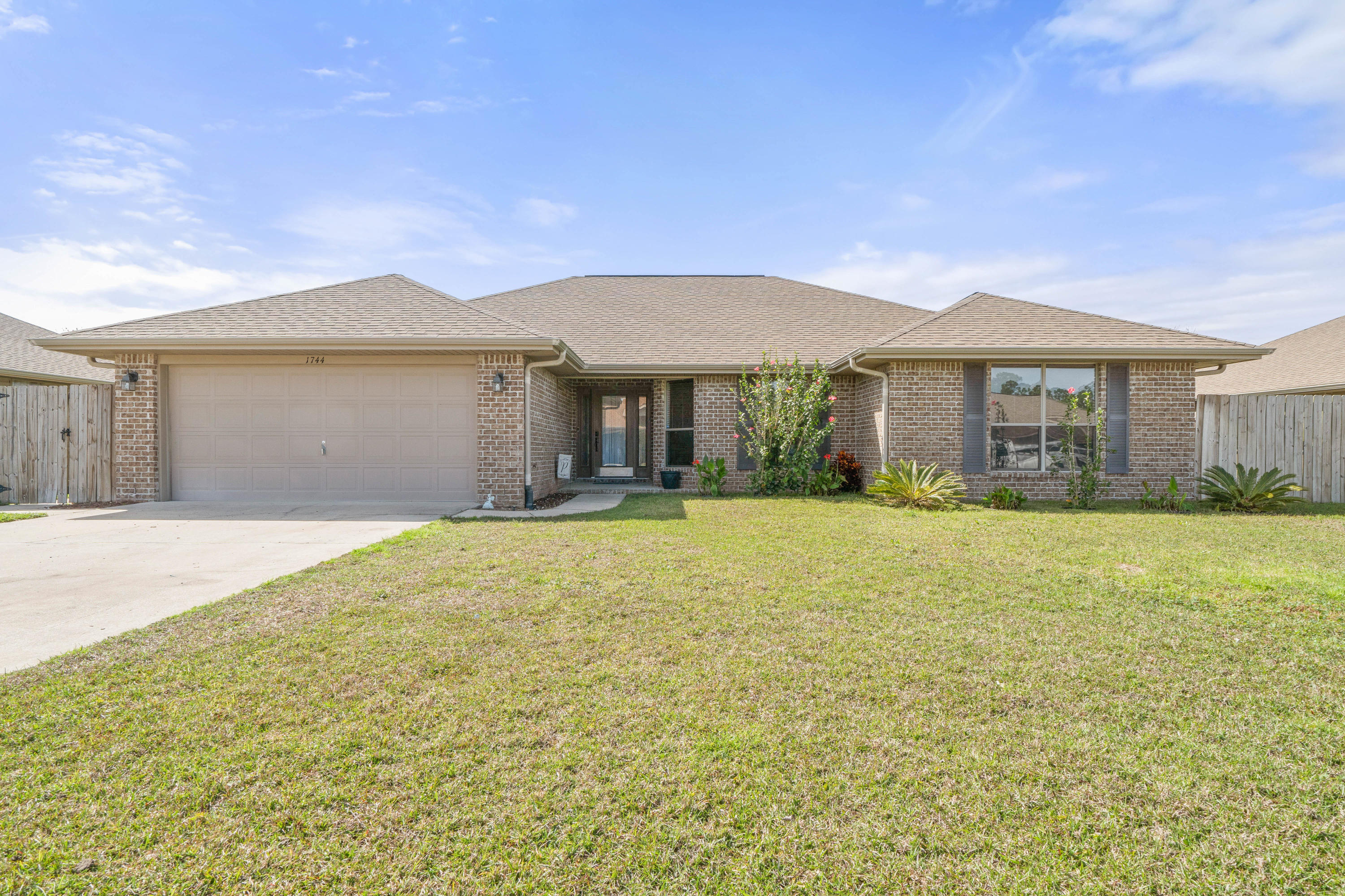 Prepare to fall in love! This beautiful and lovingly cared for brick home is move-in ready and an easy commute to beaches and bases! Featuring 3 bedrooms and 2 bathrooms, this home has a very large open living space and multi-functional dining room. All stainless-steel appliances, island, huge pantry and eat-in dining area all make the kitchen a dream! Travertine flooring, newer carpet and beautiful laminate accent this home very well. The master bathroom updates include a beautiful walk-in tiled shower and the easy to maintain backyard will be your sanctuary with a large screened and enclosed patio!
