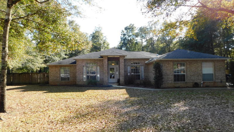 Come & take a look at this beautiful Ranch style home on one acre and with an in ground pool. This offers a very private setting in a rural subdivision. The property is completely fenced and 1/2 is left in wooded space for enjoyment. There are several outbuildings, carport, workshop and room for RV/Boat parking with a double gate through the wood privacy fencing. There is an in ground sprinkler system, white railed fenced along the road, all brick exterior and so much room out back in the woods. Inside, you will find three bedrooms laid out in a split bedroom floor plan and an extra office/ media room. There is a separate, formal dining room along with a breakfast nook that overlooks the pool area and screened in sunroom. The large kitchen comes with all major appliances & a center island