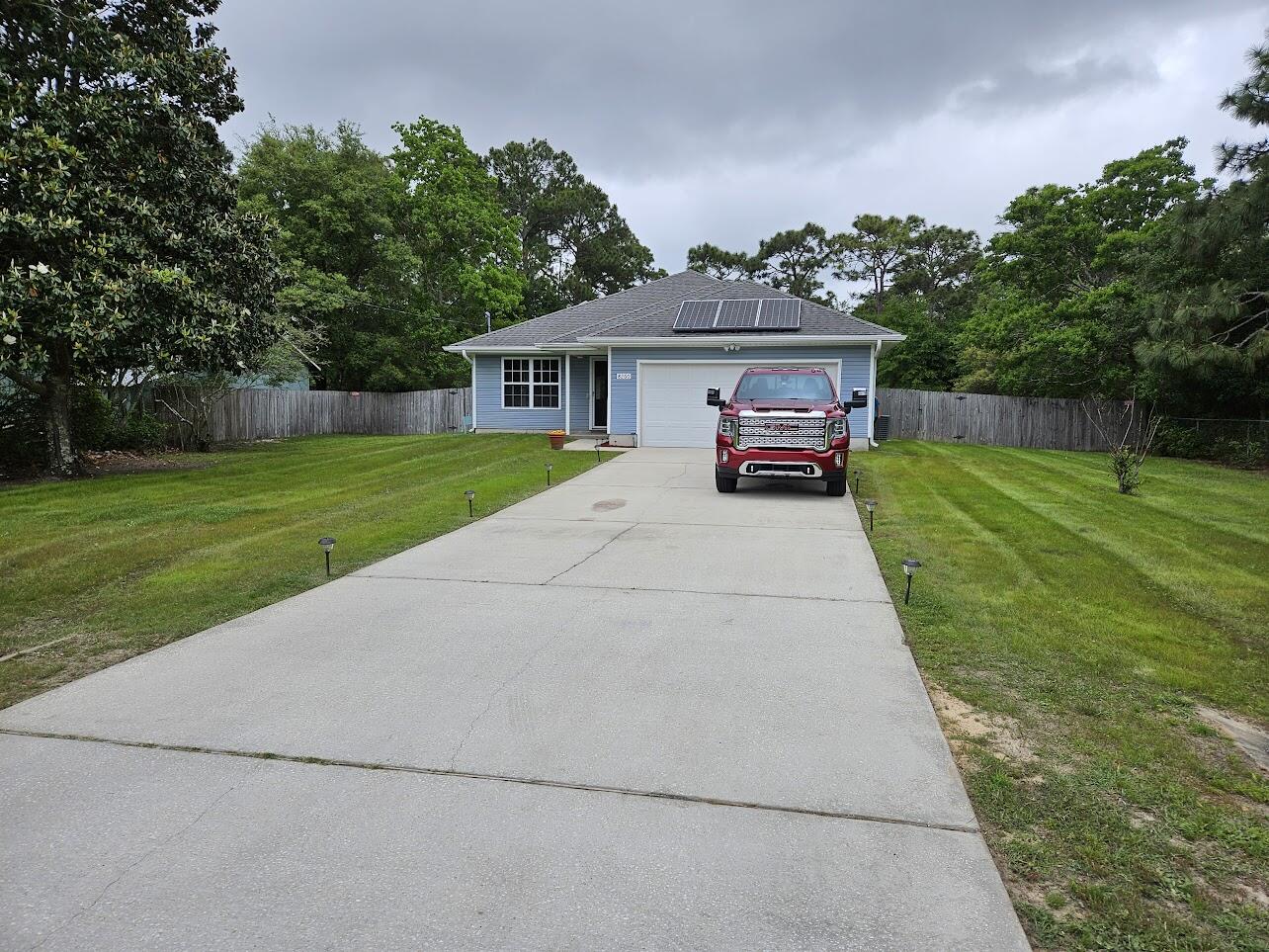 Check out this meticulously maintained home in the center of Navarre, The owner installed solar panels, the electric bill is significantly less. Open floor plan, large family room, master has trayed ceiling, walk-in closet. Master bather features double vanities, separate garden tub. laminate wood flooring. Covered patio, oversized fenced back yard. Tenant is responsible for taking care of the yard.