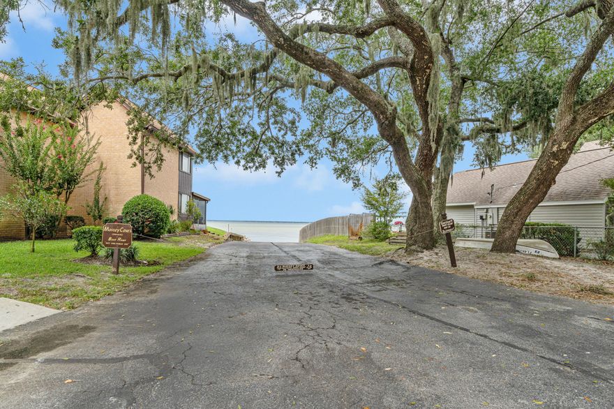 This WATER VIEW townhouse screams **OPPORTUNITY** in Destin FL! With some TLC and an eye for potential this house could be a Floridian dream. AMAZING price on this 2 bedroom 2 bathroom house, just steps from a private boat launch! Comes with BRAND NEW appliances still in the box. Balcony off of mater bedroom, in a fun ''village feel'' community.**Contact listing agent for bid and quotes on remodeling! Don't miss the chance to own this townhouse by the bay for a steal of a price!