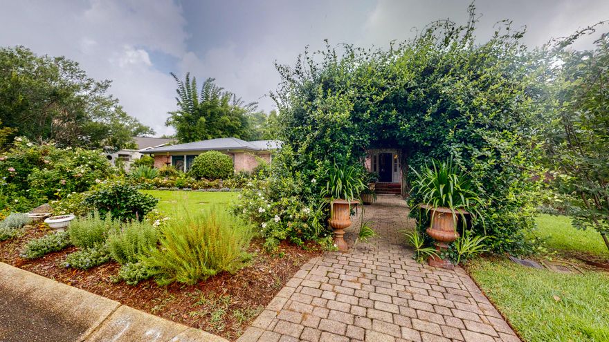 Extraordinary 3 Bedroom 3 Bath renovated brick Midcentury Ranch in the much sought after East Hill Neighborhood of Pensacola.  Eclectic design elements bring together the old with the new and marry modern elements with beautiful antiques to create the perfect timeless haven.Each room is flooded with natural light from large windows boasting Kravitz Velvet Drapes and custom fit shades.  The original oak hardwood floors have been refinished through the home giving a cohesive feel as you transition from room to room,  Each living space has been customized with Farrows and Ball Paint as well as luxury high end wallpaper from Schumacher, Osborne & Little, Christian Lacroix, and Coleman.  Custom closet systems are in each bedroom. All bathrooms have been recently remodeled.