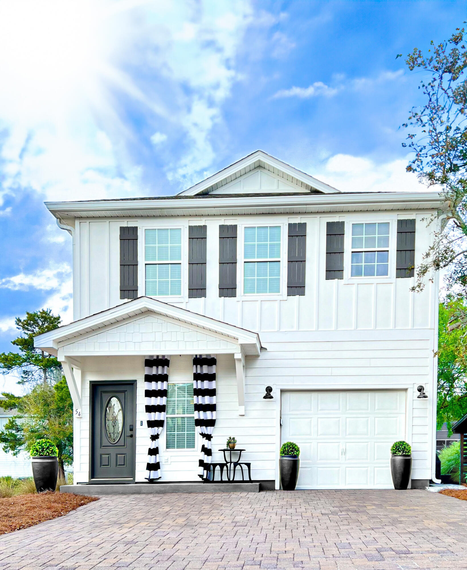 PRICED TO SELL!!! Upgrades in every room, lighting, professional design with ALL furnishings to convey. Beautiful, expansive upgrades in 2025 this bungalow less than .5 miles to public beach access right outside of Rosemary Beach and 30A avenue. 10Ft fence for privacy, beautiful pavers in the back, gorgeous dining and living area on the first floor, with a garage/game room + beach equipment storage. Upstairs you'll find three -spacious- bedrooms, including a large King bed + primary suite and a Jack-and-Jill bath for guests. The home's coastal design and abundant natural light create a warm, airy atmosphere. Shopping, Restaurants, arcades nearby & highly sought after beach spots = perfect as, second home or STR investment property with LOW HOA - Add a hot tub + golf cart and STAND OUT