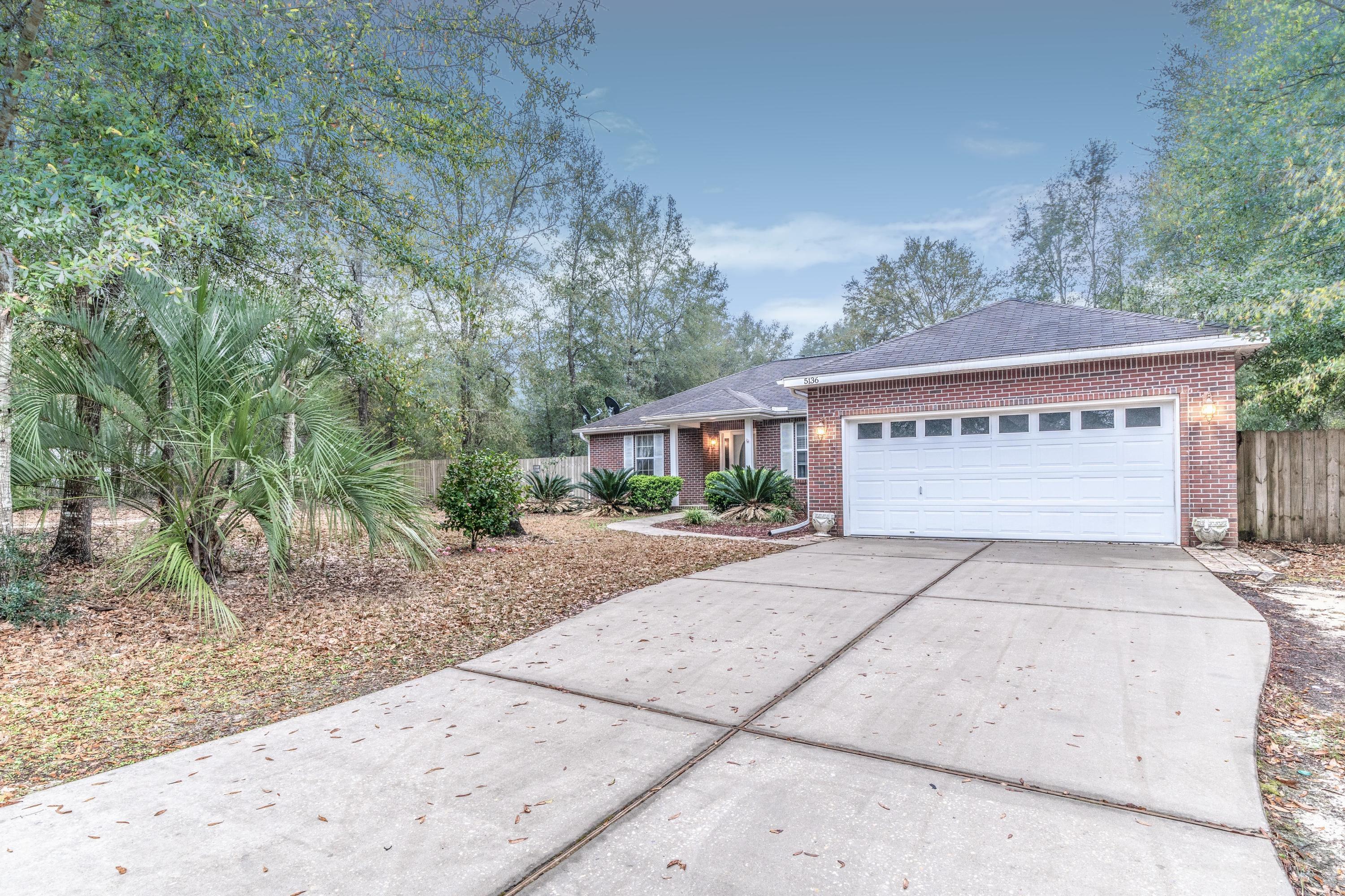 Fantastic 3/2 in Baker on a 1 acre lot! Check out the outdoor pond, workshop, and covered sun room. There is also a large gate to fit Boat/RV in the backyard.This home features tile flooring throughout, stainless steel appliances, an office, & double sinks in the master. Come by and see it today!