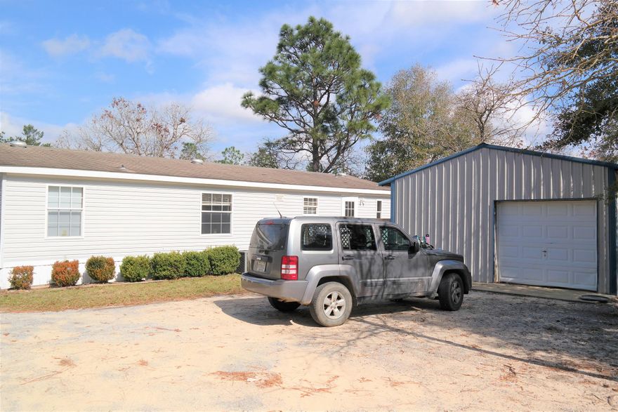 What a great place located in the Mossy Head area of Defuniak Springs! Home sits on apx. 1 acre, with road frontage on Tulip Ave and Crocus. There is a 20x20 shop; open decks on front and back; Covered RV parking; chicken house and fenced area for your pets. New HVAC installed in 2016 and currently under a maintenance contract through One Hour H&C. All appliances (including washer/dryer) included in sale! Walk in closets in all bedrooms. Master bath has garden tub, double vanities and separate shower. Also, wood burning fireplace, open floor plan, generous laundry room. Schedule your showing today!