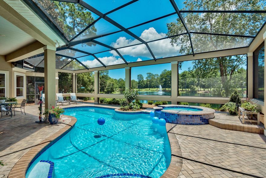 As you enter custom mahogany doors, silver glimmers on the lake attract your eye to a copse of loblolly pines on the 7th hole of the Burnt Pine Golf Course. This home embraces every element of coastal living. Sliding doors beam continual views of the landscape, natural light flows through transoms creating a panorama of nature. Beautifully appointed interiors include custom built-ins, travertine, hardwood, and crown moldings that define each space. Large living/dining area segues to gourmet kitchen. Master suite, an oasis of tranquility, w/ super-sized shower, soak tub, spacious vanity. Three bedrooms, three baths, private office, family room, laundry/craft room, customized closets and the must-have amenity of a lovely sparkling pool, the heart of indoor/outdoor lifestyle.