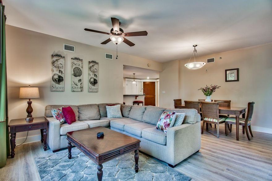 This beautifully decorated 2nd floor end unit with large balcony has a relaxing view of the Grand Gardens,The Grand Pool area, and of the Choctawhatchee Bay.  A wall of windows allows plenty of natural light throughout. The wide plank wood look of  the luxury vinyl tile gives a fresh new look and is easy to maintain.  The master bedroom enjoys views to the bay and the spacious master bath has a double sink vanity, garden tub and a separate walk in shower. The guest bedroom has its own full sized bath, too.Large tropical pool with walk in edge along with a kids pool and hot tub.Lasata owners enjoy the use of the Solstice club- a cottage on the bay with kitchen, living area, screened porch and grilling areas.