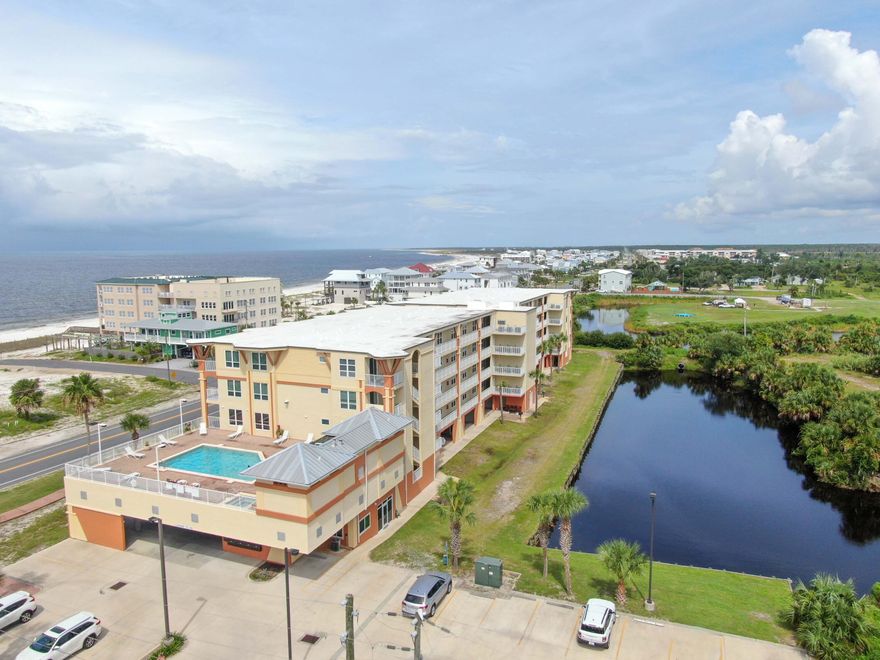 BREATHTAKING GULF VIEWS from the kitchen, living area, & master bedroom of this 3BD, 2 BA condo at Summerhouse in Mexico Beach. Being sold fully furnished  with a highly coveted storage unit steps from your door.  These rarely become available! Perfect for storing all of your beach items. Beautiful natural light from the side windows of this corner unit. Renovations since Hurricane Michael include new lower kitchen cabinets, new master bath cabinets & shower tile, luxury vinyl flooring, new windows, new sliding glass doors, new railings on the large covered balcony.  Public beach access is directly across the street from this unit. Hot tub & elevated pool with gulf view on the 2nd floor. This unit is not currently on the rental market, but Summerhouse units have great rental histories!
