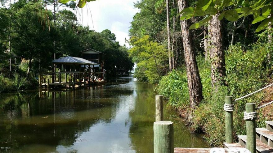 This exceptional lot is perfectly located with 75 feet of Canal frontage in Pt. Washington. Stairs and a dock are already in place. Enjoy canoeing and boating with quick access to the Bay. Build your dream home in this beautiful area where in minutes you can drive to 30A beaches, boutique shopping and dining and be only approximately 30 minutes from Destin and Panama City. Lot is high and dry and can be hooked up to water and sewer and there are no HOA fees. This lot is truly a must se
