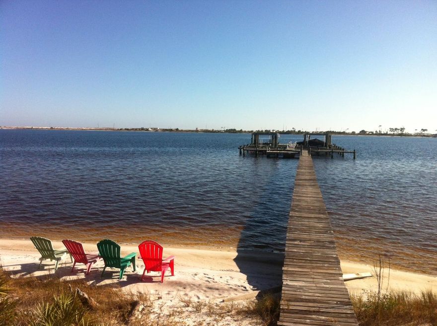 This wonderful home site is located in the lovely water side neighborhood of Sparkling Waters. Prime location directly adjacent to the walk way to the gazebo and dock where you can keep your boat. Catch rays on the beach and watch the boats go by. Bring your fishing gear and water toys. Build your dream home here and you will have water views from the 2nd floor. Buyer to verify all information.