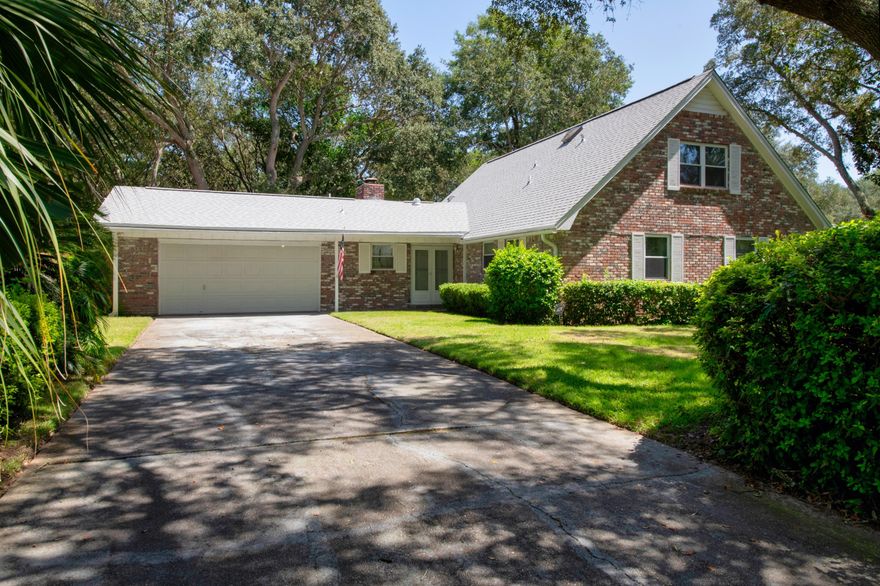 Enough room for everyone! Situated on a gorgeous lot with lush landscaping in beautiful Lake Lorraine, the yard has plenty of shade from mature oak trees. Enjoy the nature from your screened back porch, or overlook your future pool! Laminate wood flooring throughout the first floor with 3 bedrooms and 2 full baths, along with 2 living areas: a formal living room and den with a fireplace. Sliding french doors open to the screened porch, large enough to be a 3rd living space.  2 full bedrooms and 1 bath located on the 2nd floor. Brand new roof, new fence gate, updated windows, large garage with room for tools and storage, and many closets throughout the home to include a large walk-in closet, and large pantry with all wood shelving. Washer and dryer convey as-is. This home has been lovingly maintained by the owner for many years, and is ready for new memories to be made. Buyer to verify all measurements