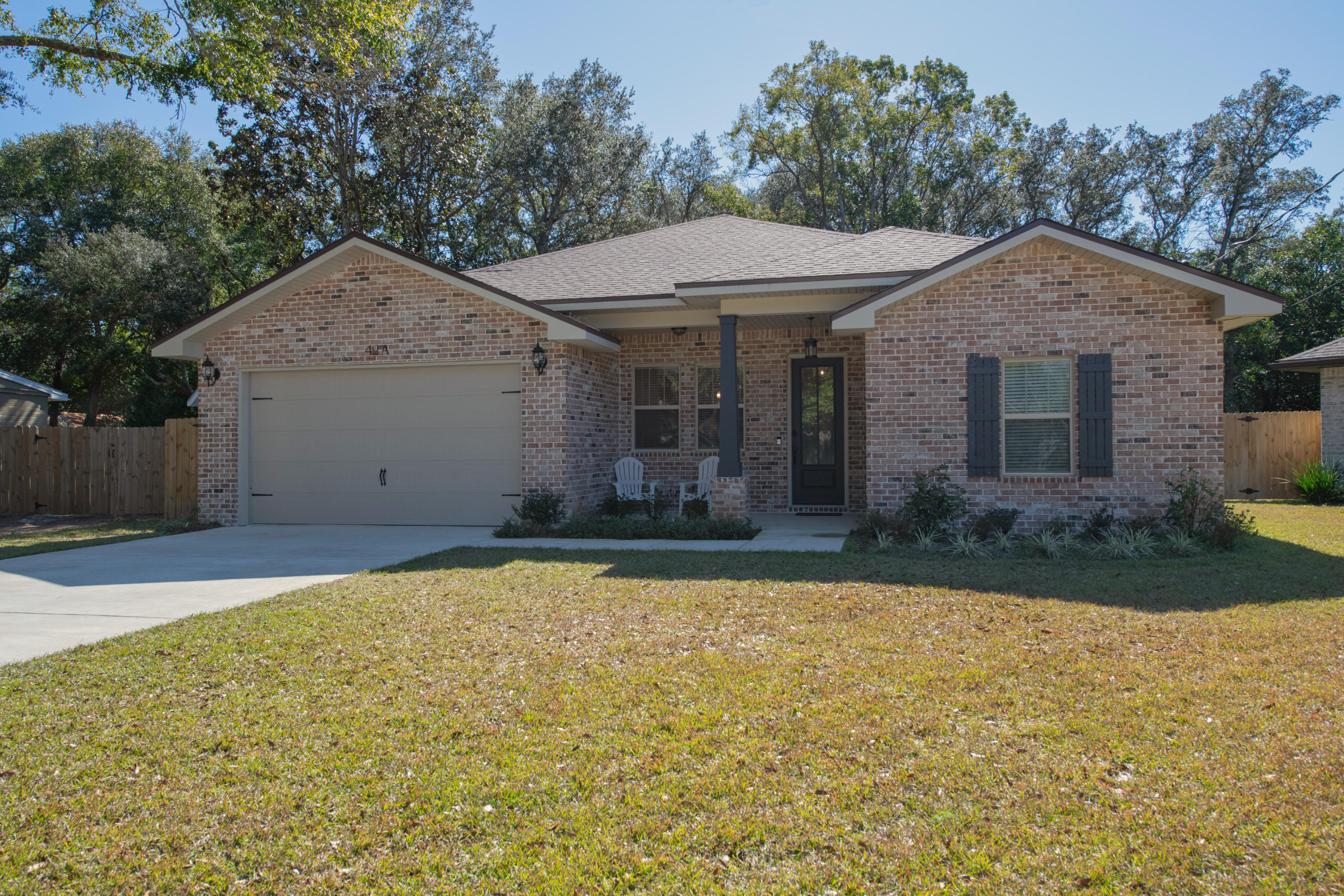 LIKE NEW!!!! This beautiful 4 bedroom 3 full bath home is located in Elliott Point and a few miles from the beach, shopping, restaurants, and downtown Fort Walton.The large open kitchen has Frigidaire professional appliances, wine refrigerator, granite countertops, 2 pantries, 2 sinks, plenty of cabinet space, and breakfast bar. Other interior features include brick wall in dining room, large bedroom closets, ring doorbell, double sinks, and granite countertops in the bathrooms. The master bedroom has 2 walk in closets, freestanding soaking bathtub, shiplap wall, separate walk in shower, and tiled floors.The large backyard is fully fenced and features a covered patio and sprinkler system.Do not miss the opportunity to own in this golf cart friendly neighborhood.