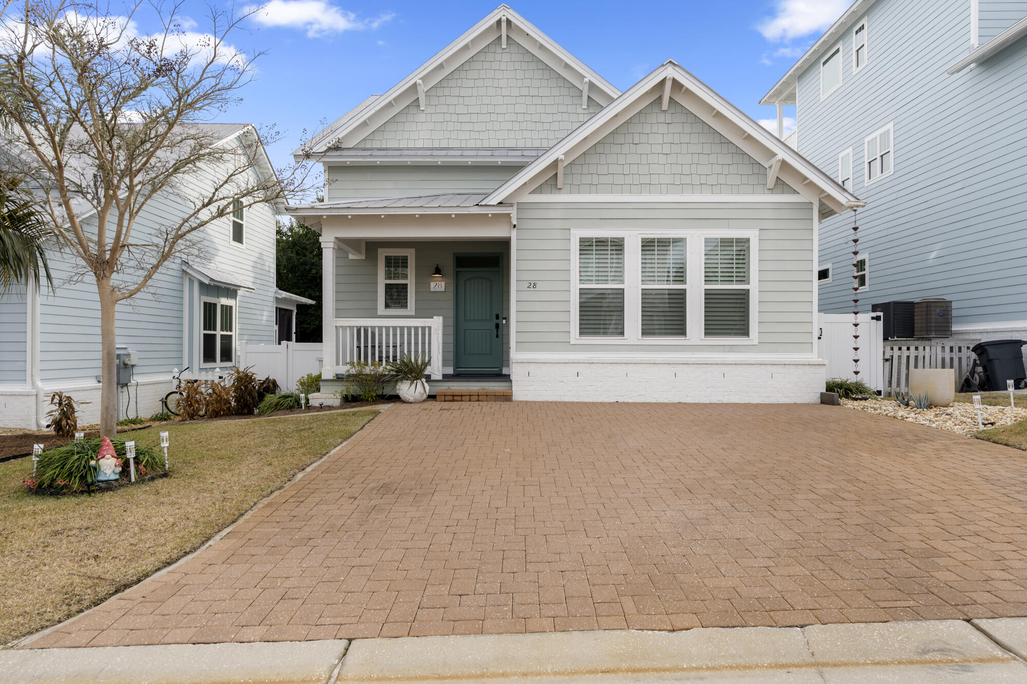 Experience coastal living at its finest in this freshly updated 1,831 sqft home in desirable Inlet Heights, Inlet Beach. Built in 2016, this 3-bedroom, 2.5-bathroom residence has been thoughtfully renovated with elegant plantation shutters throughout and new hardwood floors in the expansive living room, kitchen, and primary suite. The newly updated kitchen stands as the heart of the home, showcasing fresh quartzite countertops, beautiful white cabinetry, stainless steel appliances, a spacious pantry, and a generous island - all flowing seamlessly into a screened-in back porch overlooking serene wooded views. The renovated bathrooms complement the home's modern updates, while the main-level primary suite offers luxury and privacy with its updated ensuite bathroom, walk-in closet, and private porch access. Two spacious guest bedrooms share a full bath upstairs, with one featuring a large walk-in closet. A flexible landing area on the second floor provides the perfect space for a home office or bonus room.
Recent outdoor improvements include a new privacy fence and low-maintenance synthetic turf backyard, creating a private retreat complemented by convenient under-deck storage. Also, home is equipped with a whole home water filtration system and tankless water heater. The home's position at the end of a quiet cul-de-sac ensures minimal traffic and maximum tranquility.
Located in Inlet Heights, residents enjoy exclusive access to Grande Pointe's amenities, including a community pool with stunning Lake Powell views and access for kayaking, paddleboarding, and fishing. The location couldn't be better - just a two-minute drive to multiple public beach accesses with ample free parking, and walking distance to 30Avenue's vibrant dining scene, including local favorites like Donut Hole, Amigos & Amici, and Idyll Hounds Proper. The newly completed pedestrian underpass provides easy access to Rosemary Beach, Alys Beach, and all the charm of Scenic Highway 30A.
Fully furnished and rental-ready (sleeps 8-10), this turnkey property presents an ideal opportunity as either a lucrative vacation rental investment or your personal coastal retreat. This perfect blend of comfort, style, and beachside convenience awaits its next chapter.