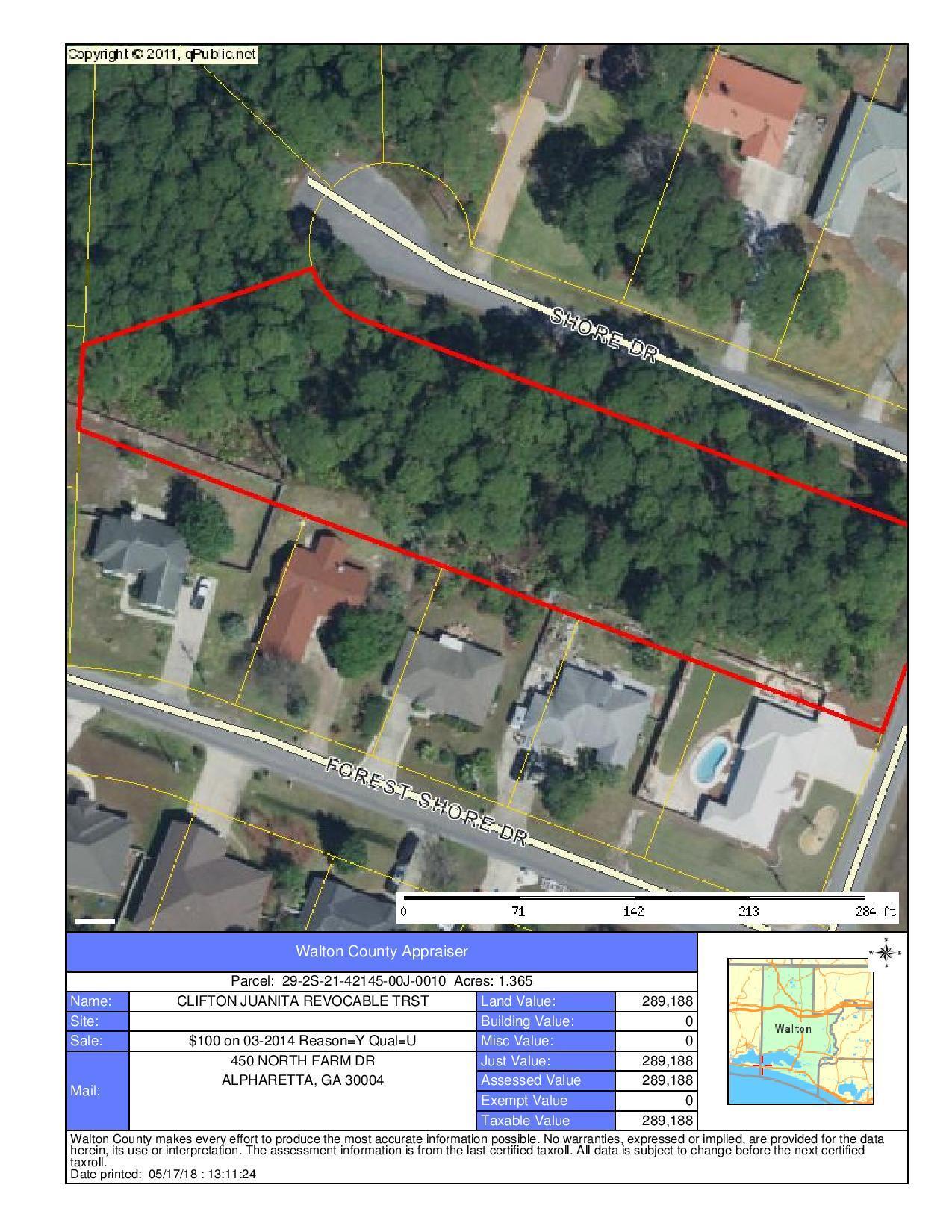 Wooded lot across street from the bay.