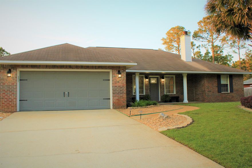 Beautiful 3 bedroom/2-bath all brick home on a half-acre lot located in the Holley by the Sea with a NEW ROOF to be put on in May 2021. As you approach the property you'll notice three gorgeous palm trees in the front yard which includes a front porch as well. As you walk through the newly painted front door you immediately notice gray wood like ceramic tile throughout the living room, dining room and kitchen with freshly painted light gray walls and a beautiful fireplace in the living room. Holley by the Sea subdivision offers many facilities which includes 8 clay tennis courts, full weight room, RV and Tent Campground and 3 pools for lap swimming and families.