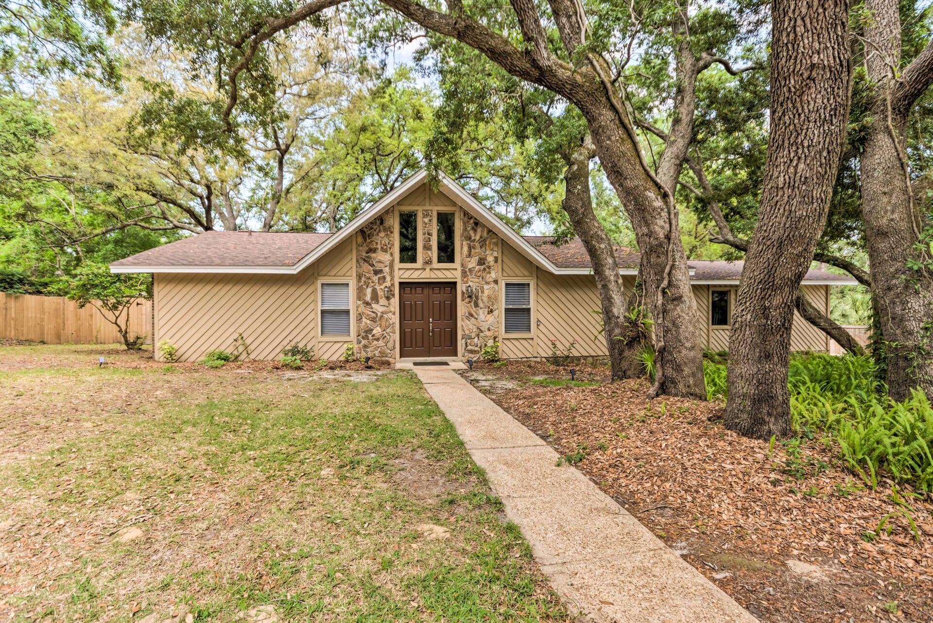 This beautifully furnished, 3 bedroom 2 bathroom home is located in Gulf Breeze. Close to shopping, restaurants and Pensacola Beach. Recently updated with and open floor plan, features new paint and LVT flooring, and carpet throughout the house. Formal dining room/office. Cathedral ceiling in Living room. Kitchen with granite countertops and stainless appliances and a breakfast bar. Laundry Room has washer/dryer for your convenience.  Freshly painted interior and exterior. Screen in back porch over looks the fenced in back yard with large live oak trees and lots of shade.   This house offers all you need. Just bring your personal items and toothbrush! No pets and no smoking on property