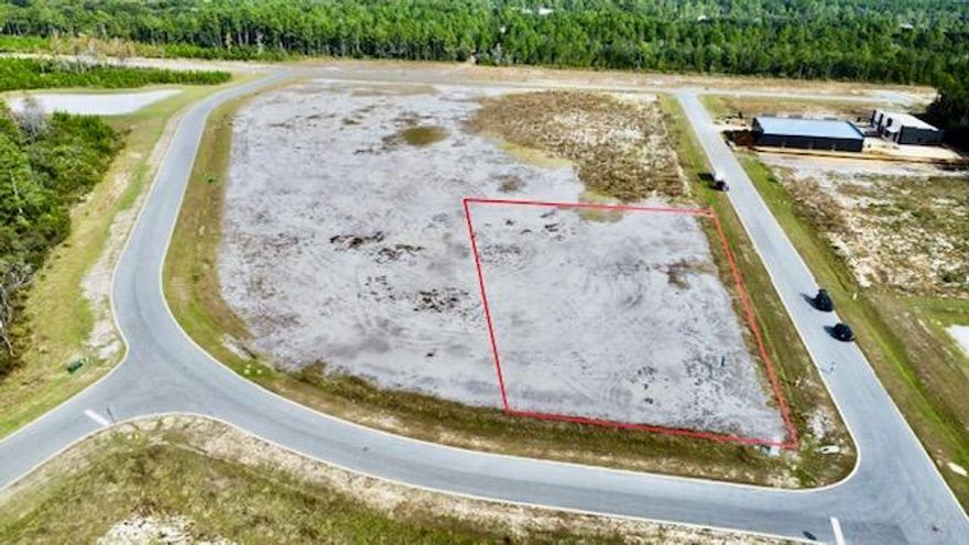 Prime commercial corner lot for sale in Phase II of the sought-after South Walton Commerce Park. Spanning 1.06 acres, this property offers dual access points, making it an ideal location for your business. Level Lot off of Serenoa Road in Flood Zone X. Please inquire for further details. All information deemed reliable but not guaranteed and prospective buyers must verify the suitability for their use. Property lines noted in photos are approximate.