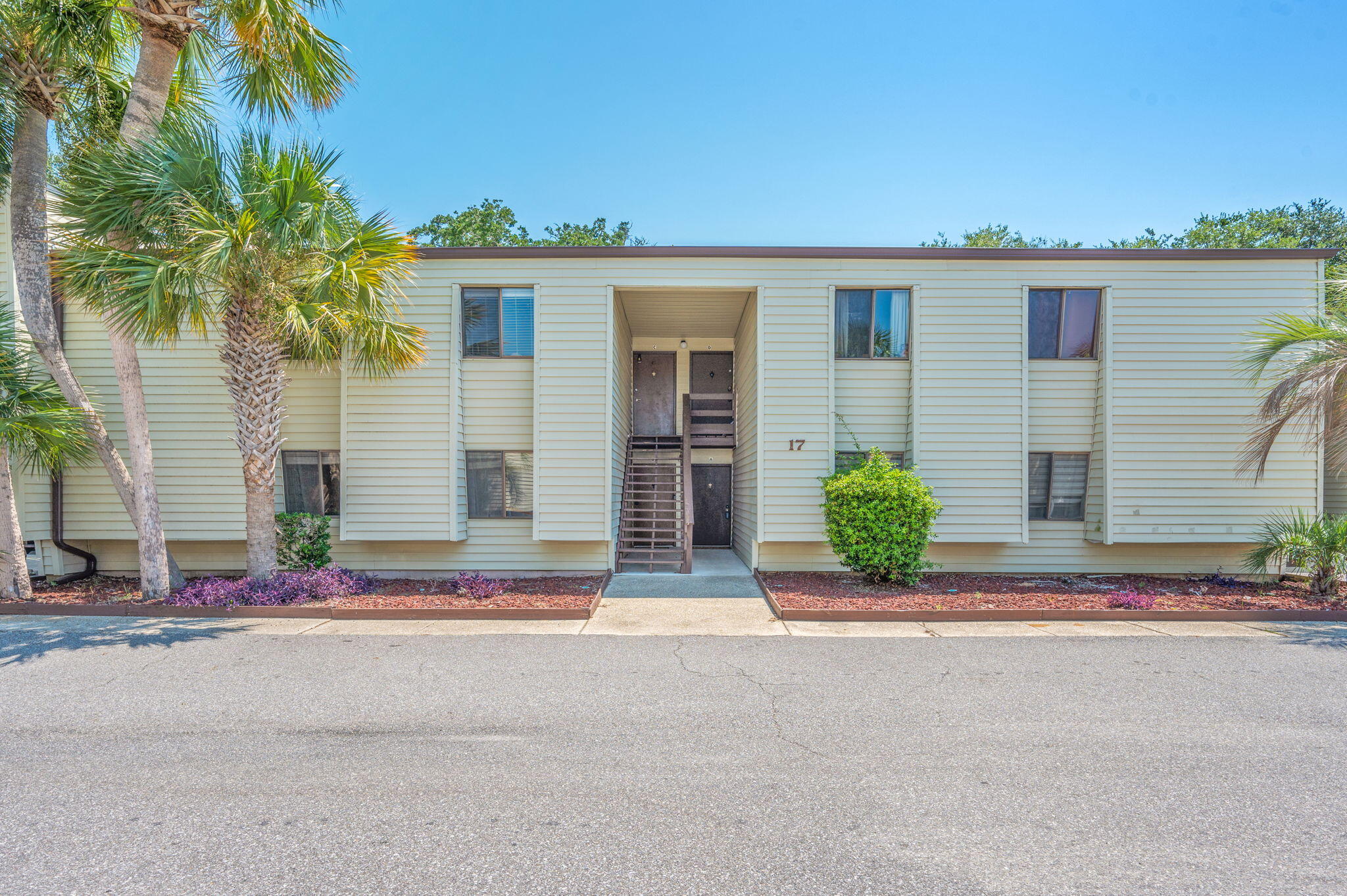 Discover this beautifully maintained 2-bedroom, 1-bath condo offering 868 square feet of comfortable living. Located on the second floor, this residence features luxury vinyl plank flooring throughout, ceiling fans in the bedrooms and living area, plus a newly installed dishwasher and microwave.Enjoy the lifestyle of a waterfront community with amenities that include a sound-front swimming pool, lighted tennis court, and clubhouse with full kitchen, billiards, and TV lounge. A fishing dock and boat slips are available through the HOA on a first-come, first-serve basis. Water, trash, and sewer are included in the HOA dues, providing added value and convenience. Please note: short-term rentals are not permitted, ensuring a stable and peaceful community environment.