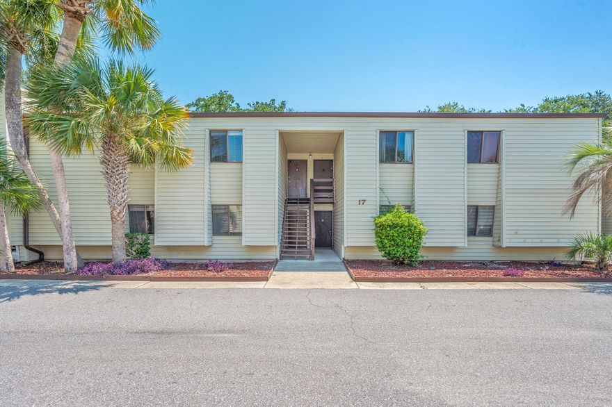 No HOA fee until Jan 2026 - Discover this beautifully maintained 2-bedroom, 1-bath condo offering 868 square feet of comfortable living. Located on the second floor, this residence features luxury vinyl plank flooring throughout, ceiling fans in the bedrooms and living area, plus a newly installed dishwasher and microwave. New A/C 2025Enjoy the lifestyle of a waterfront community with amenities that include a sound-front swimming pool,  tennis court, and clubhouse with full kitchen, billiards, and TV lounge. A fishing dock and boat slips are available through the HOA on a first-come, first-serve basis. Water, trash, and sewer are included in the HOA dues, providing added value and convenience. Please note: short-term rentals are not permitted, ensuring a peaceful community.
