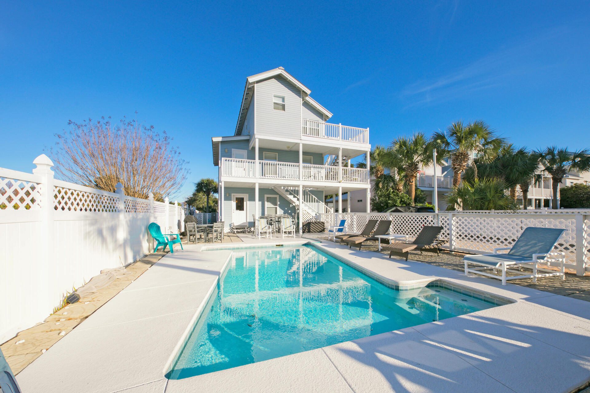 Confession Time - This is a RARE find in today's market! A Rental Machine! This spacious and stunning 3 story beach home features both modern amenities and architectural character and is located in the highly desired Crystal Beach! This stunner boasts 6 spacious bedrooms, three kitchens, a storybook wraparound wood porch, and a lavishing heated pool. Lounge away pool side or take in the beautiful sights from your oversized private balconies - this is one your friends, family and vacationing guests will enjoy for a lifetime. This home Boasts an amazing historical rental history. Located just a few steps away from the world's most beautiful beaches, world class shopping, restaurants and all that Destin has to offer. The bright lights of Destin are calling you home and the beach awaits.