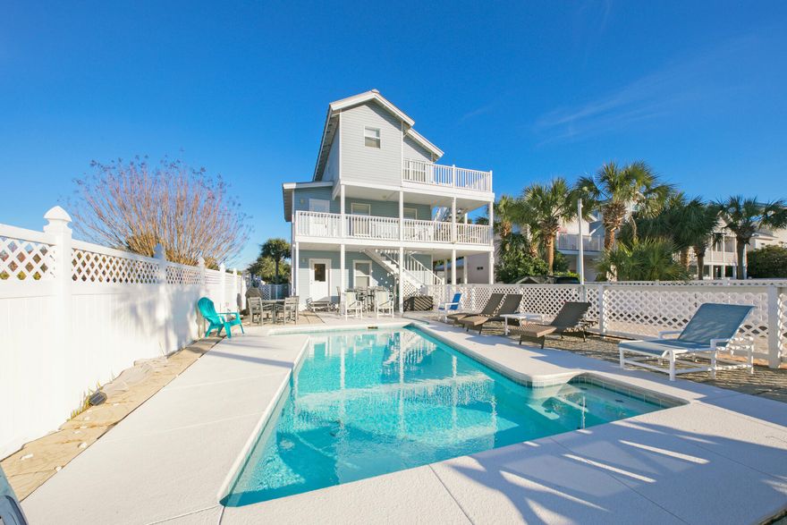 Confession Time - This is a RARE find in today's market! A Rental Machine! This spacious and stunning 3 story beach home features both modern amenities and architectural character and is located in the highly desired Crystal Beach! This stunner boasts 6 spacious bedrooms, three kitchens, a storybook wraparound wood porch, and a lavishing heated pool.  Lounge away pool side or take in the beautiful sights from your oversized private balconies - this is one your friends, family and vacationing guests will enjoy for a lifetime. This home Boasts an amazing historical rental history. Located just a few steps away from the world's most beautiful beaches, world class shopping, restaurants and all that Destin has to offer. The bright lights of Destin are calling you home and the beach awaits.