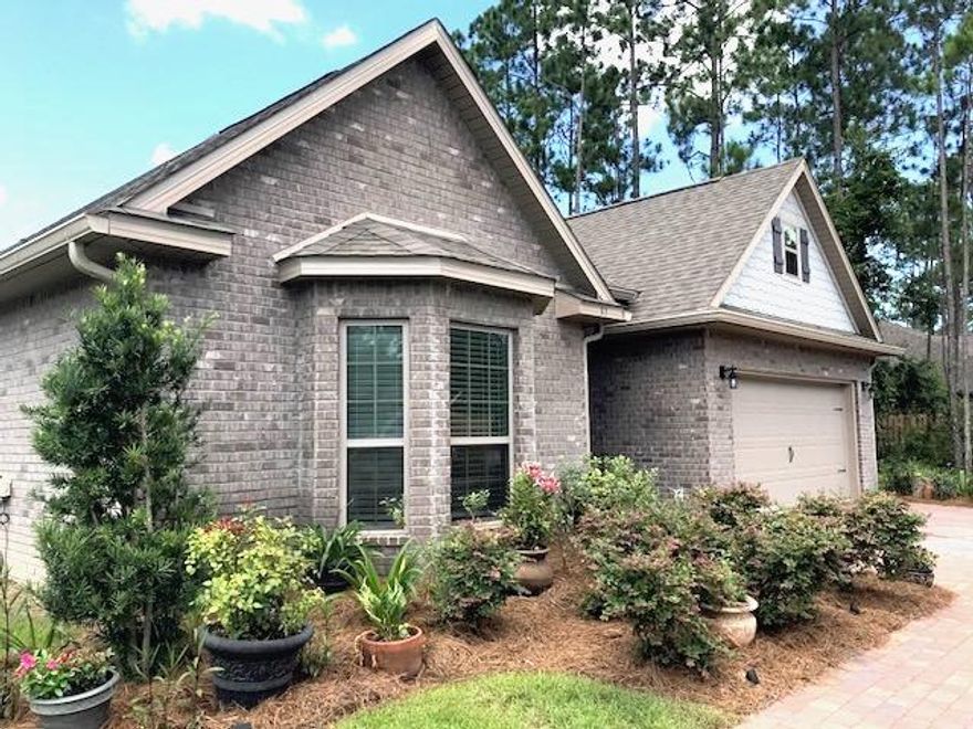 WOW What a find!!! This is a fabulous 3 bedroom 2 bath home with a large corner lot and a 2 car garage! It is located 2 tenths of a mile from the N Eden Park on the bay. The home is three years old and features many upgrades including Vaulted ceilings, granite and stainless kitchen and ceiling fans throughout., not to mention the pavered entry along with the pavers in the back fully fenced yard. The flooring is a beautiful porcelain complimented with wood. The master has recently been upgraded with LVT Plank. Adjacent the family room is the large kitchen and breakfast bar. The master bedroom is very spacious with ample space for an additional sitting area.  Relax in the large garden tub or end the day in the oversized fully tiled shower. The two additional bedrooms are spacious and share a full bath. The dining room is offset from kitchen and is filled with natural light from the brick pavered back patio and covered porch.  The back entertaining area is very large and surrounded by grass and beautiful plantings perfect for outdoor entertaining.  This home sits on a large corner lot.  Hurry it will not last long!  Many Many Upgrades!!!