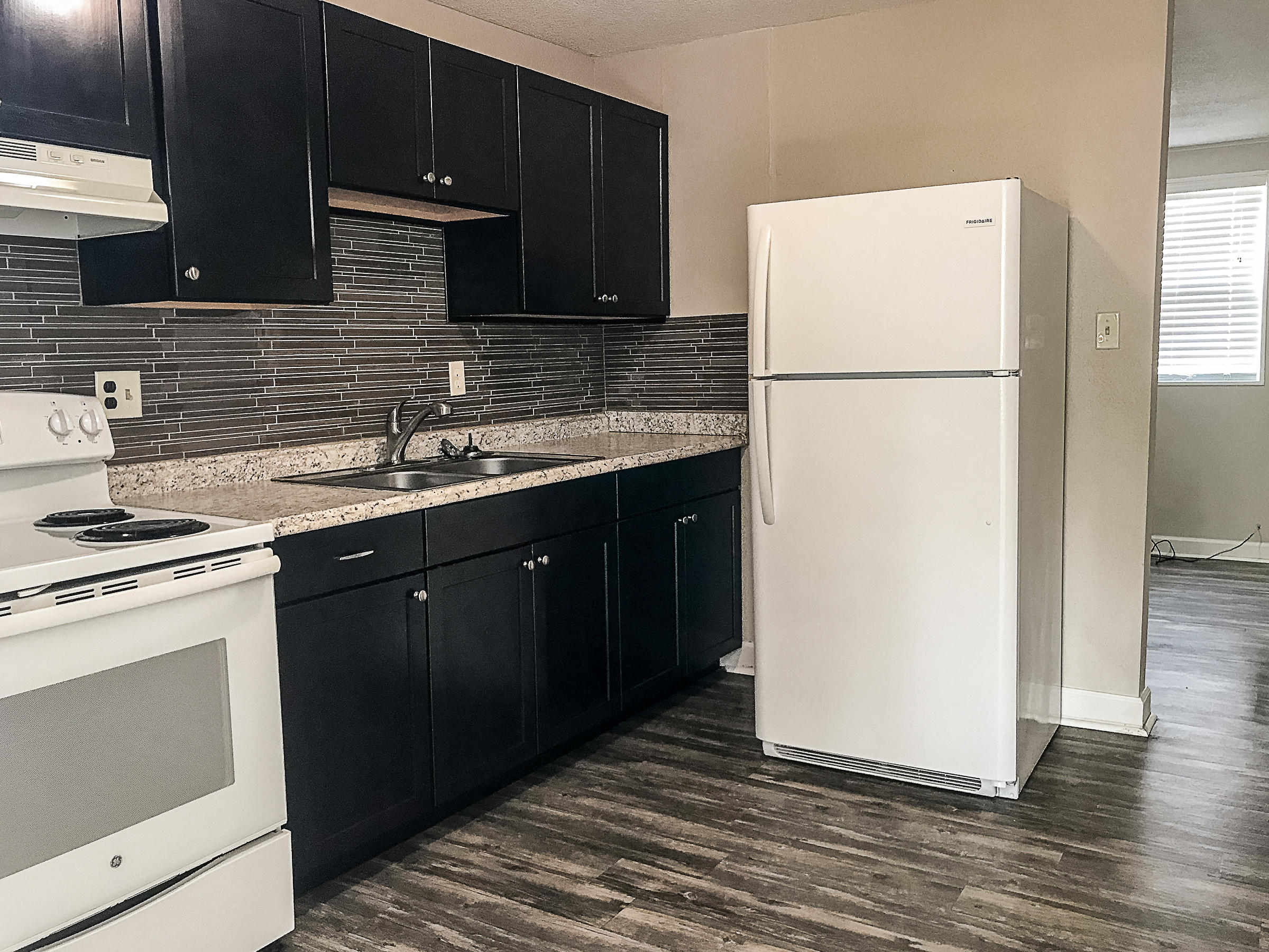 Available 04/21/2025..... Downstairs unit just minutes from the base. Easy access to beaches, bases and shopping. 2 bedrooms and 1 bath. Neutral paint, vinyl plank flooring, tile in the bathroom and kitchen back splash with updated lighting. Parking lot for parking. Minutes from the base gate. Quarterly pest control service. No smoking. No vaping. No pets allowed.