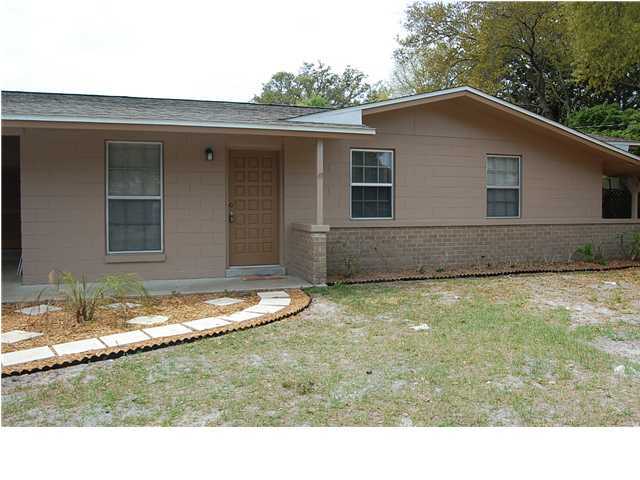 Nice updates to this home! Located on quiet cul-de-sac, interior has wood and tile floors throughout! Open floor plan for kitchen and dining area with side entry door to carport and sliding glass doors to screened back porch! Great size back yard with additional storage/work shop in corner. Owner willing to allow dog only under 40lbs.