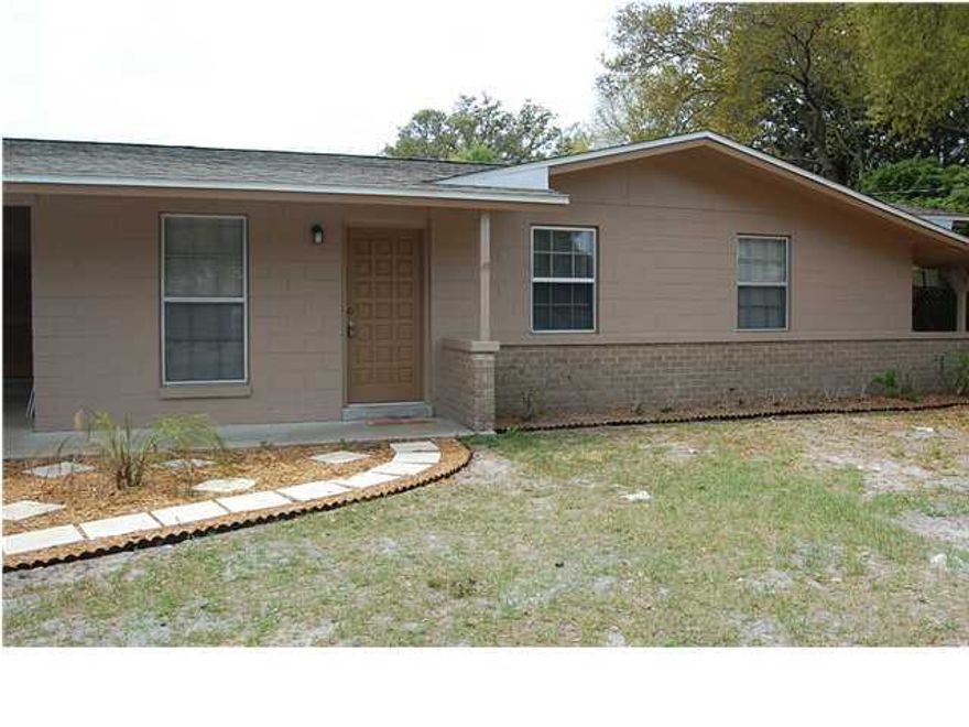 Nice updates to this home! Located on quiet cul-de-sac, interior has wood and tile floors throughout! Open floor plan for kitchen and dining area with side entry door to carport and sliding glass doors to screened back porch! Great size back yard with additional storage/work shop in corner. Owner willing to allow dog only under 40lbs.