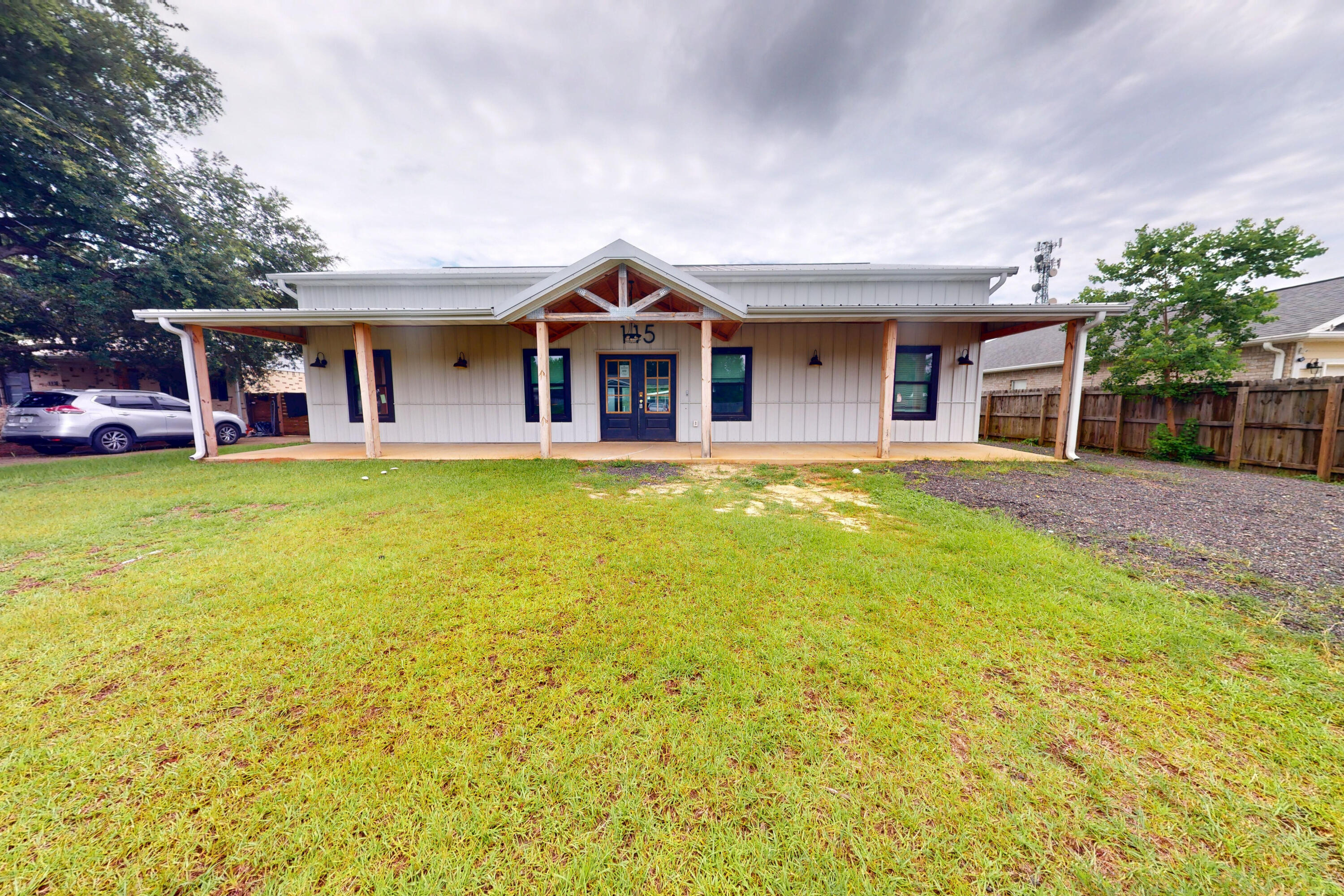 Built in 2023, this modern farmhouse offers a rare blend of style, space, and function just minutes from Hurlburt Field, local schools, shopping, and the white-sand beaches of the Emerald Coast. Designed with a ranch-style layout on the main level and a spacious loft upstairs, this 2-story home features 5 bedrooms, 3.5 bathrooms, and soaring 11-foot ceilings throughout the main floor.Enjoy bamboo flooring throughout, a bright open living area, and a well-equipped kitchen with new stainless steel appliances. The nearly half-acre lot is fully fenced and includes two detached outbuildings with electric--ideal for workshops, storage, or hobby space. With durable metal roofing and siding, this home is built for long-lasting performance.