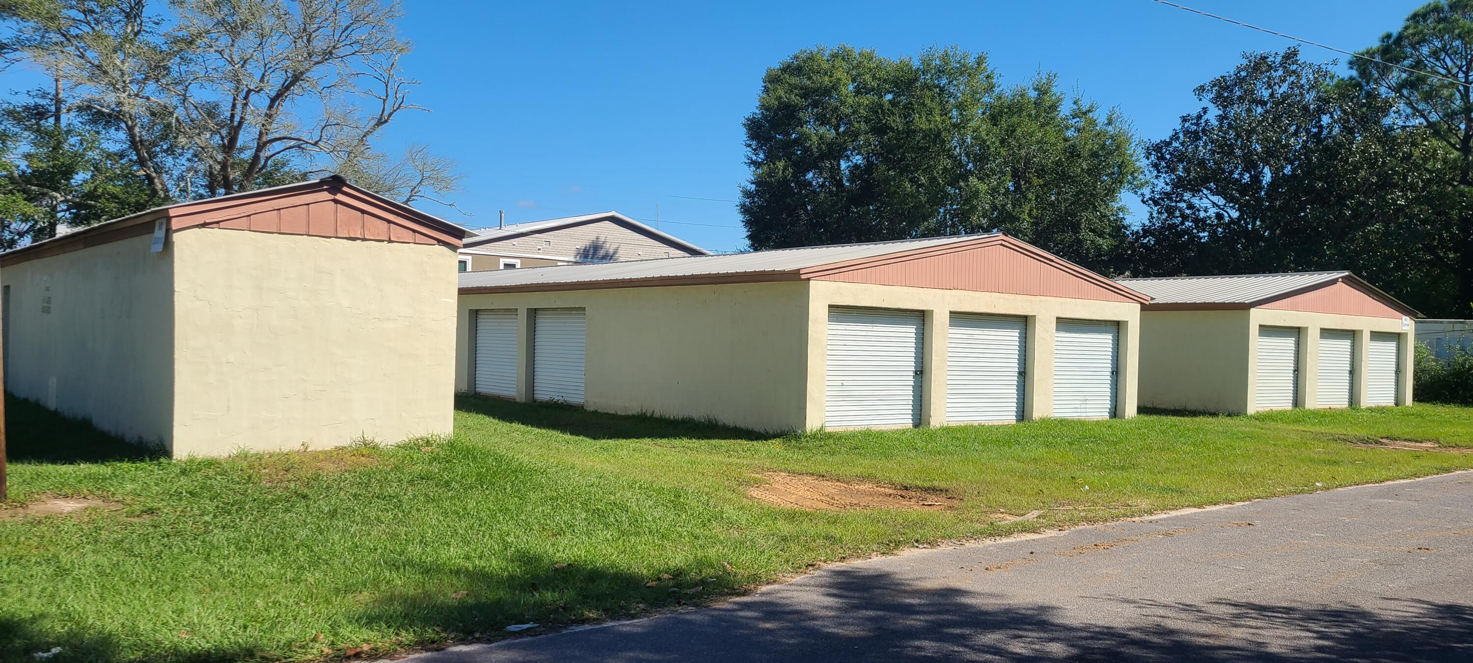Turn Key Incoming Producing property in a very established area. Sale consists of two parcels consisting of 4 separate buildings including 61 storage units. First parcel has two 2400 sq ft buildings and smaller 800 sq ft building, very visible from a main traffic road. All three have newer metal roofs. The other parcel has a single 2400 sq ft building that also has a newer roof. With a little marketing the Potential income if 100% capacity would be over 13% cap rate. Great investment!