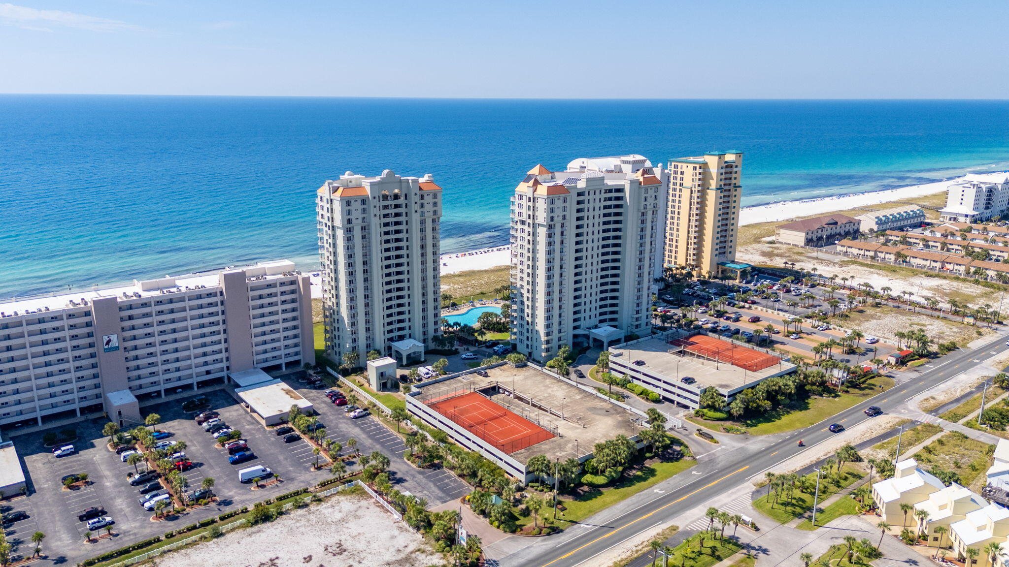 | $77,250 in rentals YTD | Beach Colony East is a Direct Gulf Front condominium with secure gated access and covered parking. Aside from substantial rental income, one appreciates immersive and panoramic Gulf and fishing pier views from nearly every room. Navarre Beach is known as more of a beachfront village than town but with coastal amenities and access one expects which keep owners and renters returning year after year. Offered fully furnished & turn-key, updated to a contemporary beach theme accented with warm tones that welcome you in from the sun and sand. Updated coastal decor, LVP, stainless appliances, HVAC, and re-tiled master shower. Master suite with king bed, balcony access and Gulfview soaking tub; guest bedroom is finished with a queen bed plus twin over twin bunks.