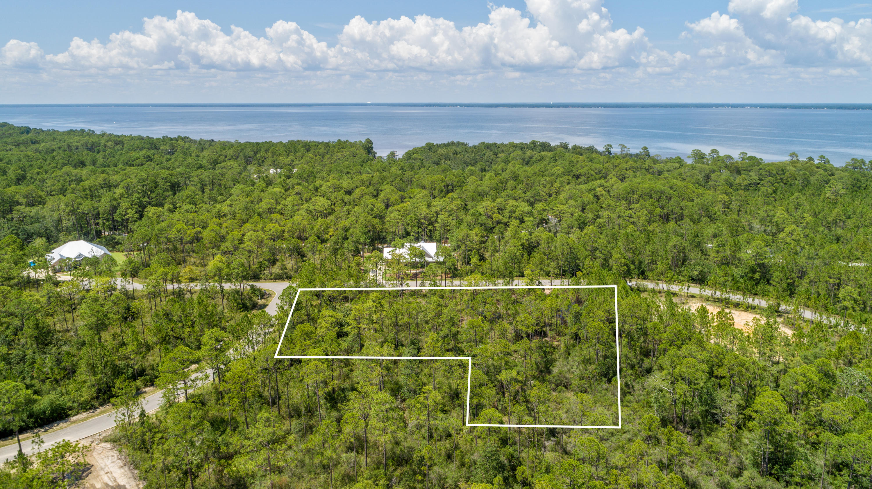 Spectacular opportunity to own one of the larger lots in Seclusion Bay! This exceptional 1 acre lot backs up to a preservation buffer and has plenty of room for a large home and spacious yard. Seclusion Bay owners enjoy gated access, underground utilities and bay access via the community dock! Great location with quick access to nearby schools, shopping, dining and of course the beautiful beaches on Scenic 30a!