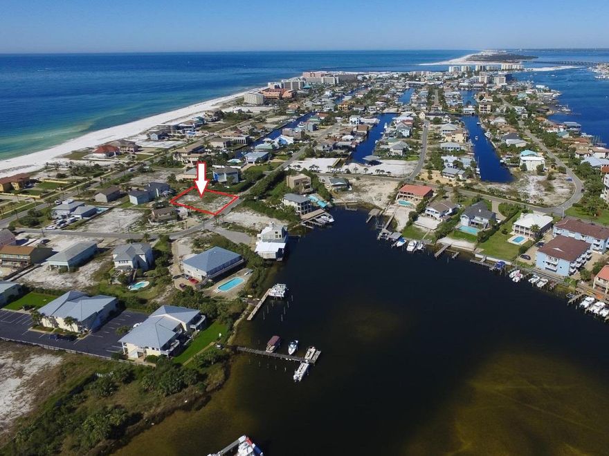 The last remaining interior lot on Holiday Isle. Enjoy expansive Gulf and Harbor views from a home built on this lot. This large lot 117x120 is Located less than a block from one of two gated beach accesses and nearly a mile of private beach. Priced to sell this lot will not last long.