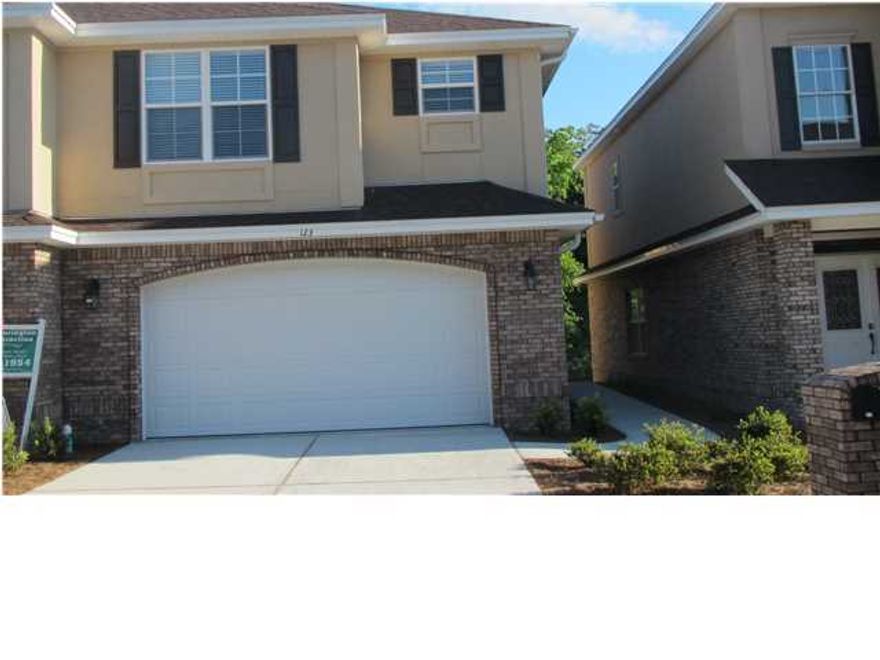 ***Move-In Special: $100 off 1st Months rent. Kitchen has maple cabinets from Legacy, granite countertops with breakfast bar, stainless steel appliances, side by side refrigerator with ice and water in the door, large tiles on floor. Living and dining areas have the tall windows and wood flooring that opens to a spacious deck. Master bath has his/her sinks, separate shower and private toilet room. The laundry room has a cabinet and separate closet and is located upstairs along with the three other bedrooms and spacious second bathroom which has cultured marble. This home has spray foam insulation in the walls and attic which will reduce your electric bills and help with noise. Located in the two car garage is a docking station for charging electric cars. CALL AGENT ONLY AT 461-1318