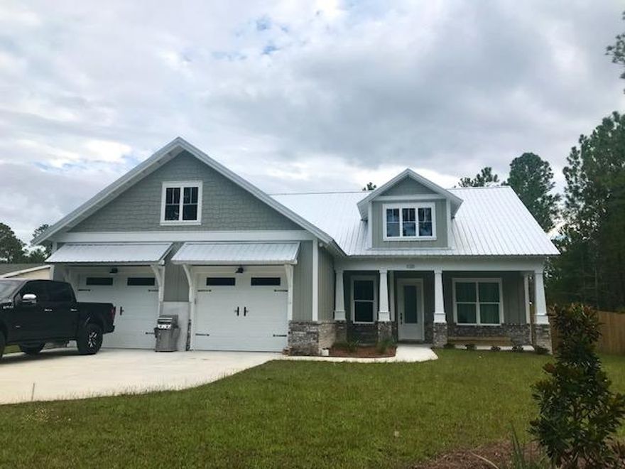 NEW CONSTRUCTION in Freeport's Newest Resort Community: BEAR CREEK! Your Luxury Coastal Lifestyle awaits...Estimated September '20 Completion...This lovely home is in South Freeport- Just over the 331 BAY bridge to the beaches of 30A & only a few minutes from the new Bay Park!! In this floorplan, you are ushered in thru the expansive front porch into this spacious 1867+ sq. ft. custom designed floorplan featuring 3 bdrm & 2.5 baths with an office/flex space w/ 2 x 6 Exterior walls construction with a Metal Roof! Stunning 10 ft ceilings with 8 ft doors in this Open / Split bedroom Floorplan with Upgraded features through-out...