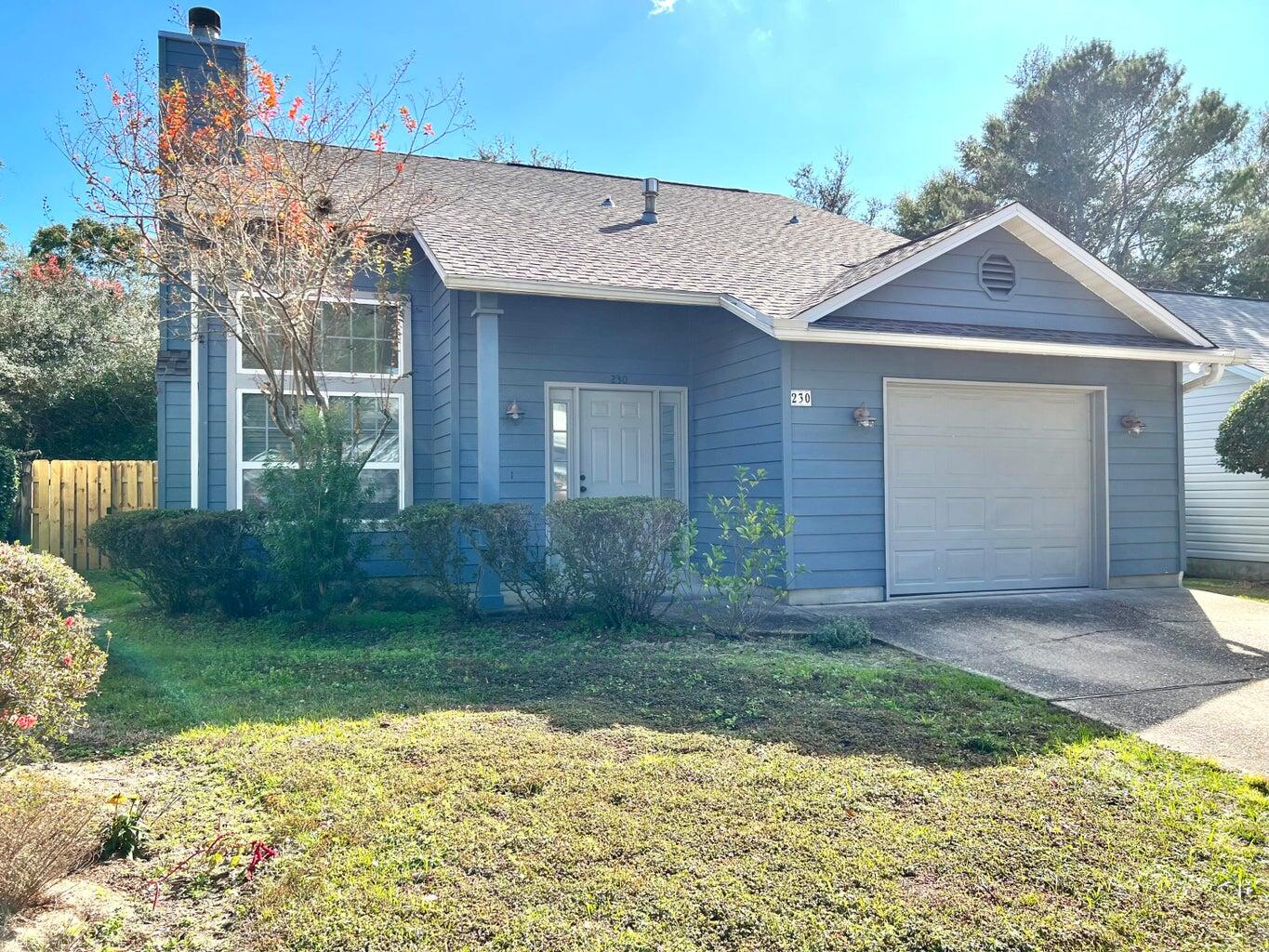 New roof in 2020! New A/C in 2023! This charming 3-bedroom, 2-bath home in Parkwood Circle is minutes from Bluewater Bay Elementary and Merchants Walk. It features a cozy living room with a wood-burning fireplace, cathedral ceilings, and a modern kitchen with granite countertops and a large breakfast bar. The Florida room at the back is bright and tiled, perfect for relaxing. The downstairs master has a walk-in closet and direct bathroom access. There's also a large pantry under the stairs. Upstairs, you'll find a plant shelf, lots of natural light, two bedrooms, and a full bath.