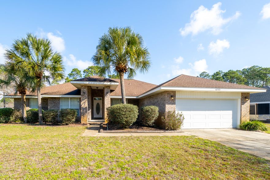 Welcome home to Holley By The Sea. This beautiful 4 bedroom 2 bath home sits on almost a half acre of land.  With 2 living rooms, a formal dining room, kitchen nook, and large outdoor space, this home was meant for entertaining.  The lovely Travertine flooring flows through the house beautifully.  The Master bath has a whirlpool tub with separate shower and his and her closets. The master bedroom has French doors leading to covered patio. You will find the additional 3 bedrooms separate from the master to be a good size as well. Enjoy the ambiance from the fireplace on a chilly night in your cozy family room. The fenced in back yard is perfect for the kids or a family barbque.  Holley by the sea is sought after so be sure to call for your private tour today.