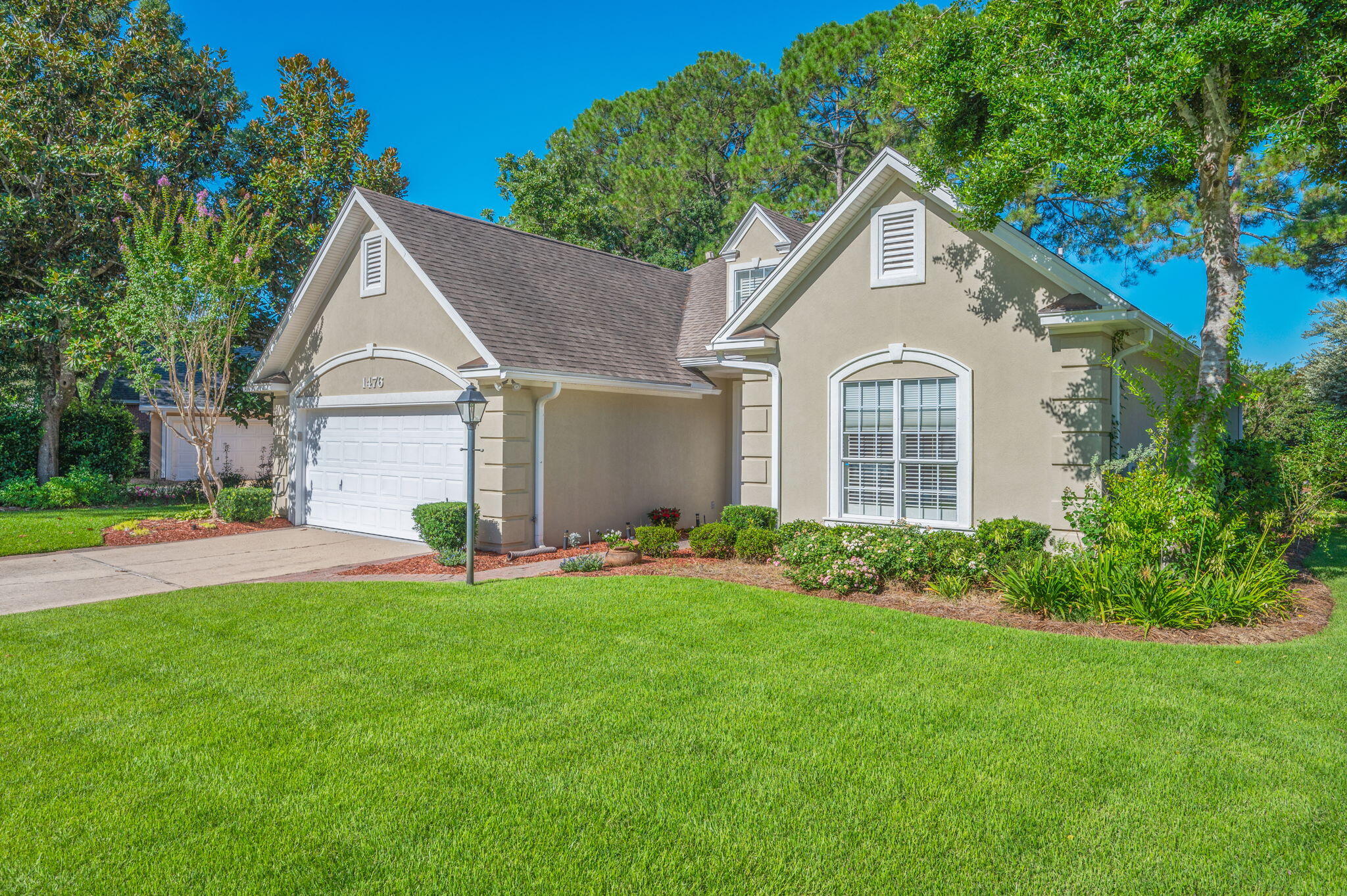 Bluewater Bay living at it's BEST!!!Welcome to 1476 Oakmont Place--a beautifully maintained, single-story home located in the highly desirable Bluewater Bay community. Nestled along the 7th hole of the Bluewater Bay golf course, this residence offers luxury, location, and low-maintenance living. Just a short walk to enjoy beautiful sunsets over Choctawhatchee Bay and quick access to Destin!Step inside to find updates galore, with Australian cypress hardwood flooring throughout the main living areas and home office (or 3rd Bedroom). The spacious living room features a cathedral ceiling, crown molding, a cozy gas fireplace, and custom drapes paired with high-quality 2-inch wood blinds. The kitchen is stunning, complete with custom cabinetry, quartz countertops, and stainless-steel appliances. The convenient laundry area is a fantastic transition area featuring a pantry closet & gas hookup (for a dryer). The open floorplan flows easily past the breakfast bar and through the dining area to an upgraded Florida room! This space is an ideal spot for morning coffee or relaxing after a long day while overlooking your GORGEOUS back yard.
Retreat to the luxurious primary suite featuring a tray ceiling, bay window, oversized walk-in closet with upgraded shelving and drawers. The ensuite bathroom is an ideal layout with walk-in shower, rainfall showerhead, and a WALK-IN linen closet.
Additional highlights include:
o Exceptional floorplan with LOTS of storage
o Guest bath with glass-enclosed tub/shower combo
o Finished two-car garage with premium floor coating, cabinetry, fast-track hooks.
o HUGE "standing height" attic with carpeted floors, extra shelving, and easy access to the gas furnace.
o Beautifully landscaped yard with irrigation system
o Roof (2013), HVAC (2018), Water Heater (2021)
o Pre-inspection completed, termite bond with Terminix, and insurance quotes available
This move-in ready home combines function, elegance, and peace of mind, all within one of Niceville's most sought-after neighborhoods. You'll really love living here...Schedule your showing today!!