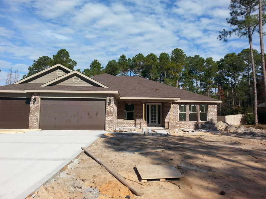 **Hidden Creek area with underground utilities and sewer**. Upon entering this 4 bed/3 bath/3 car garage home you're greeting with 10' raised ceilings, 20'' tile throughout main living area, and an office bathed in natural light from triple windows and 8' glass french doors. The stunning kitchen is the heart of the home and perfect for entertaining. It features large bar top for individual seating, Espresso wood cabinets with over and under lights, large island with electric and ''pot drawers'' for storage, double-ovens with cook-top, and a good size space for kitchen table. The master suite is on the opposite side from the other 3 bedrooms. It offers private entrance to the covered lanai overlooking the back yard; trey ceiling, & two large walk-in closets..(more)...