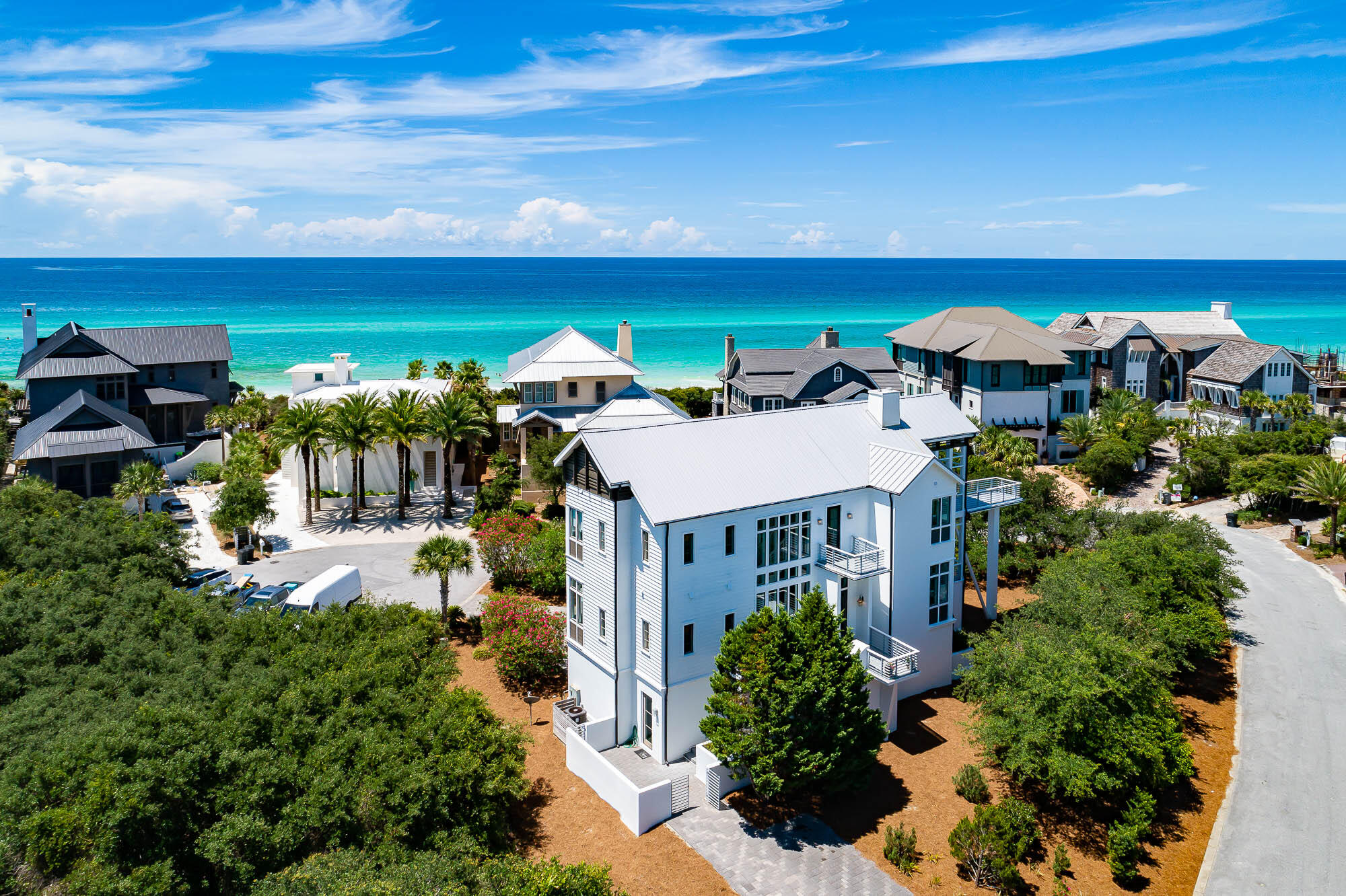 Poised south of 30A and one tier from the Gulf, 137 Camp Creek Point boasts a prominent and serene location and touts stunning Gulf and coastal dune lake views! With gated access, the ultra-private community of Camp Creek Point is comprised of only 16 home sites and perched on a magnificent point, offering a rare serenity and deeded beach access and lake access, both just steps from the home. Short-term rentals are restricted, further adding to a quiet coastal lifestyle. Architect Tom Christ designed this residence, which boasts a spacious and comfortable floor plan with ample natural light and multiple decks with stunning water vistas. Upon entering through the front door of the home, located on the second level, you are greeted by the impressive open living area, combining