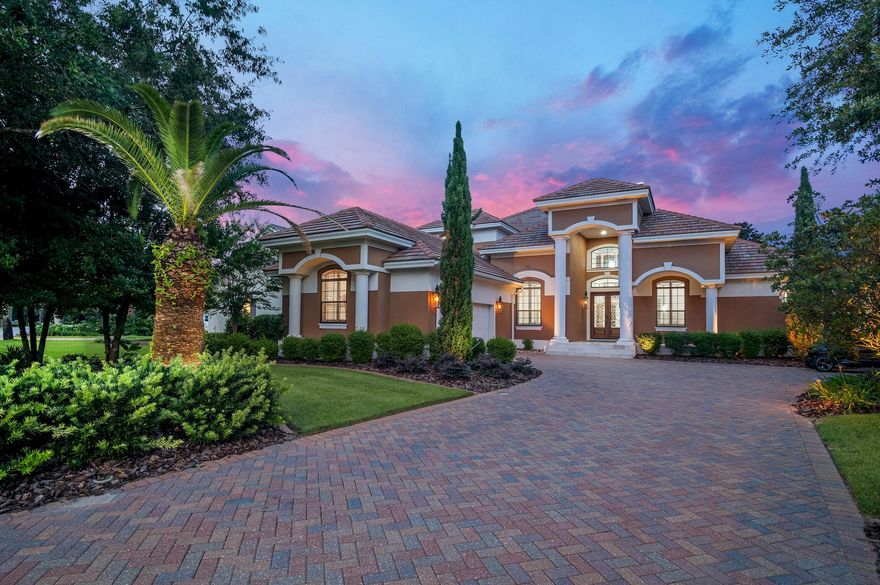 This exquisite home, located on the 15th green of Regatta Bay's impressive 18-hole golf course, offers luxury and elegance at every turn. Featuring an open floor plan with 4 bedrooms, an additional office, a formal dining area, a heated pool and spa with a sitting area and outdoor kitchen, The garage is a 2-car plus golf cart, this residence provides ample space and versatility for any lifestyle. Gas lights add warmth and style to the entry and pool area, complemented by newly installed landscaping and lights.The grand living and family rooms boast soaring 22' ceilings, creating an expansive and airy ambiance. Crown molding and recessed lighting enhance the sophisticated atmosphere, while abundant sunshine illuminates the space. Recently updated with a 22' fireplace, new wood floors,